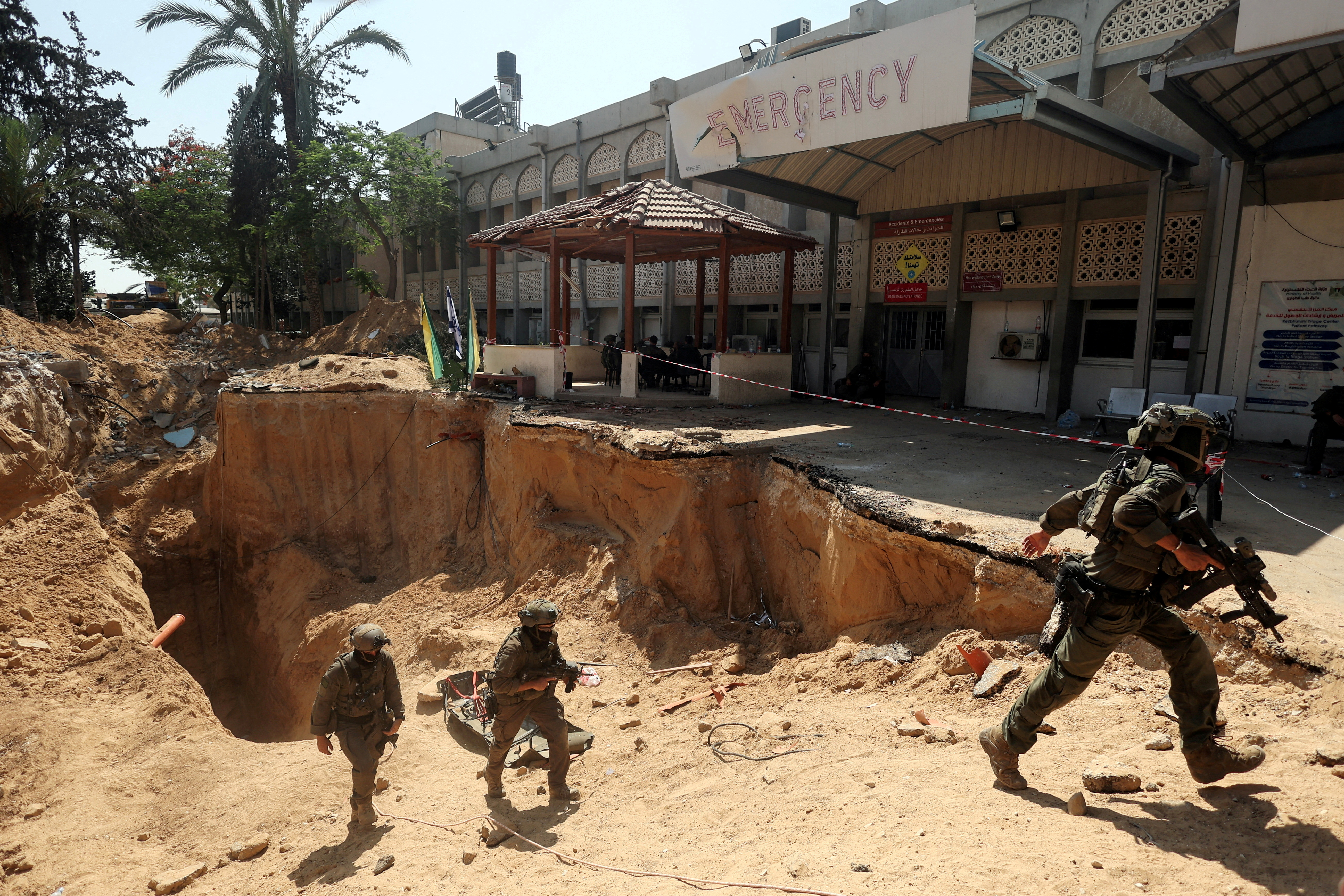 FILE PHOTO: Israeli soldiers walk out from a tunnel underneath the European