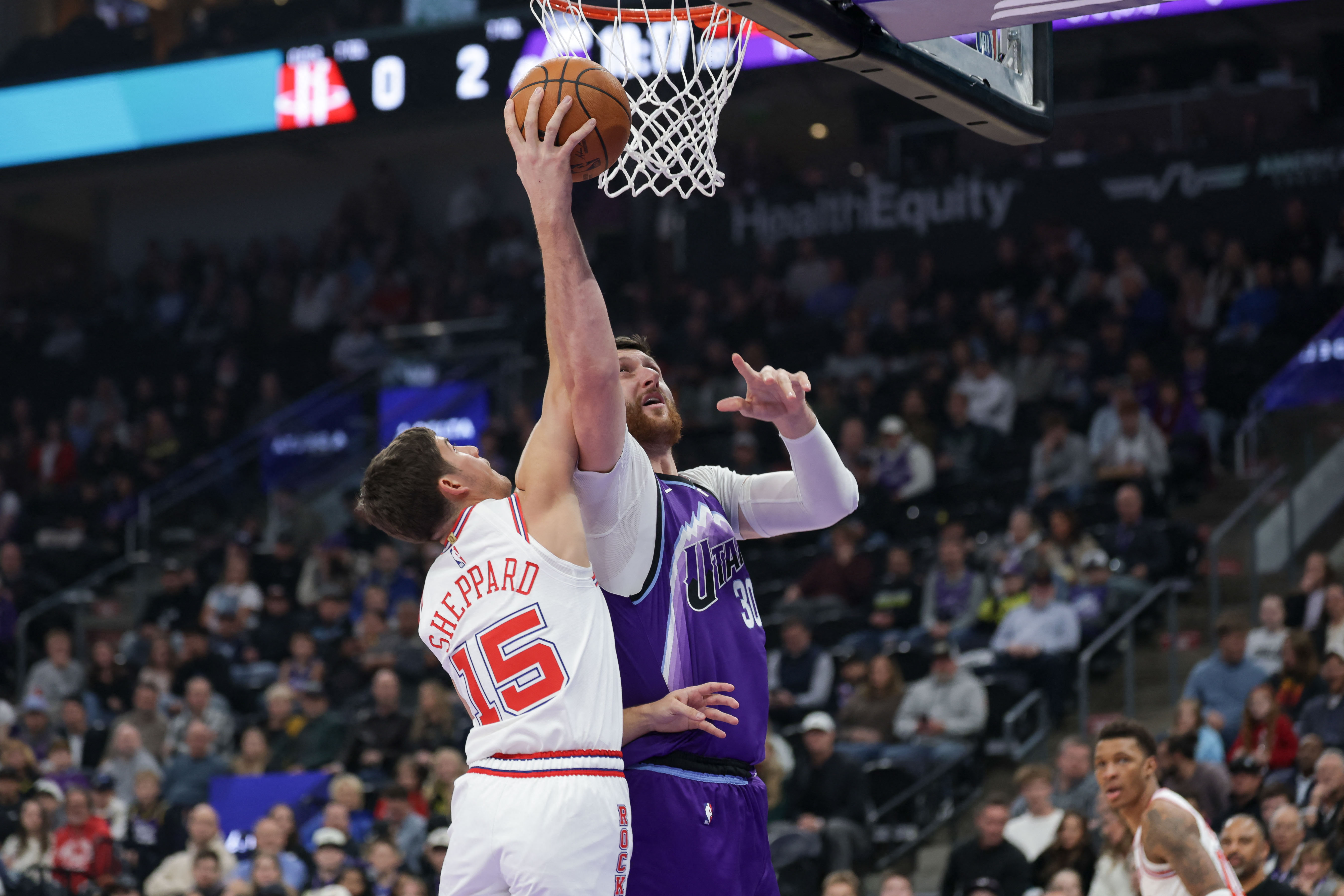 Dec 1, 2025; Salt Lake City, Utah, USA;  Utah Jazz center Jusuf Nurkic (30) is fouled by Houston Rockets guard Reed Sheppard (15) while shooting during the first quarter at Delta Center. Mandatory Credit: Chris Nicoll-Imagn Images