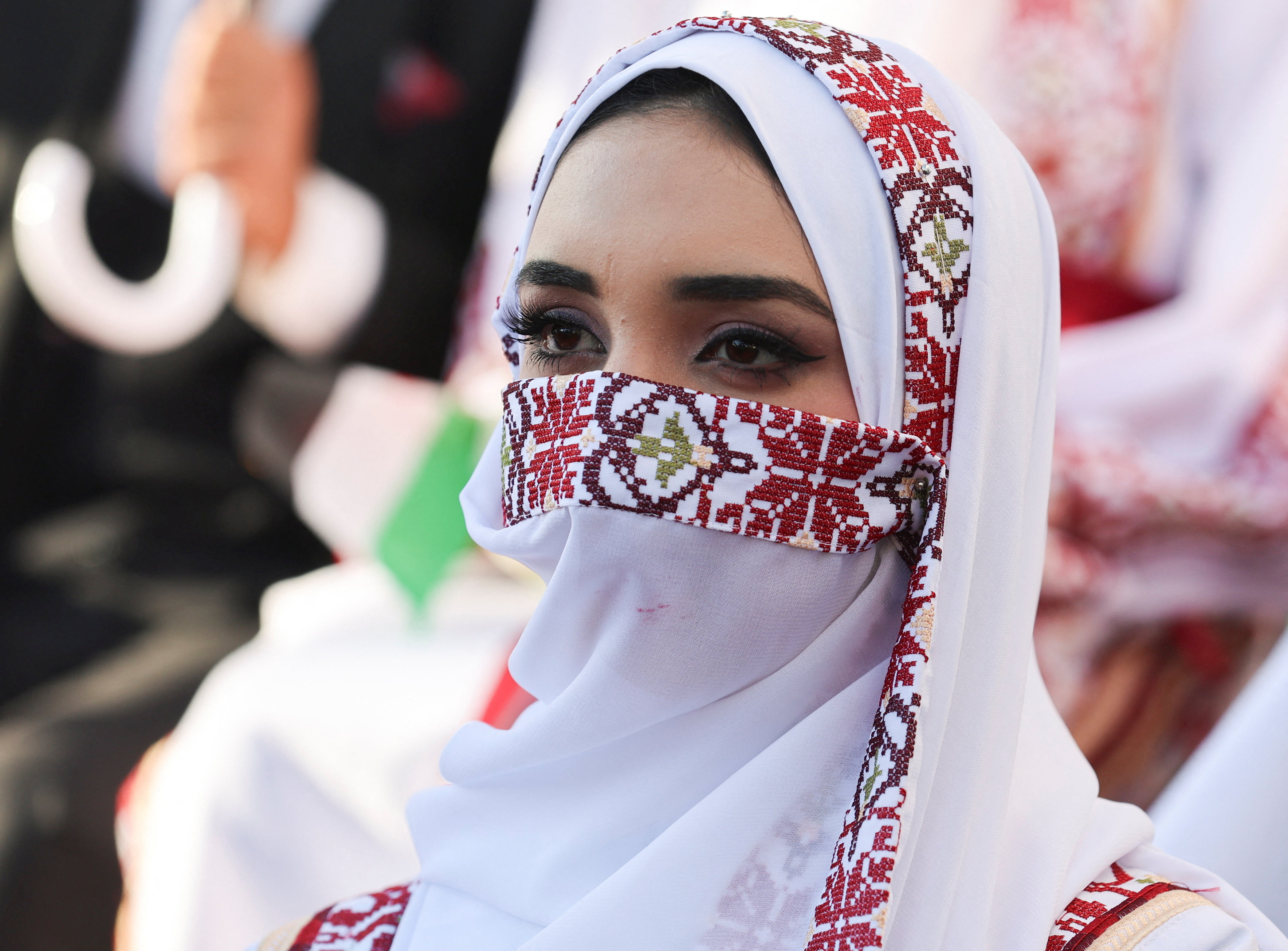 A bride looks on during a mass wedding for 54 couples in Khan Younis, in the southern Gaza Strip December 2, 2025. REUTERS/Ramadan Abed
