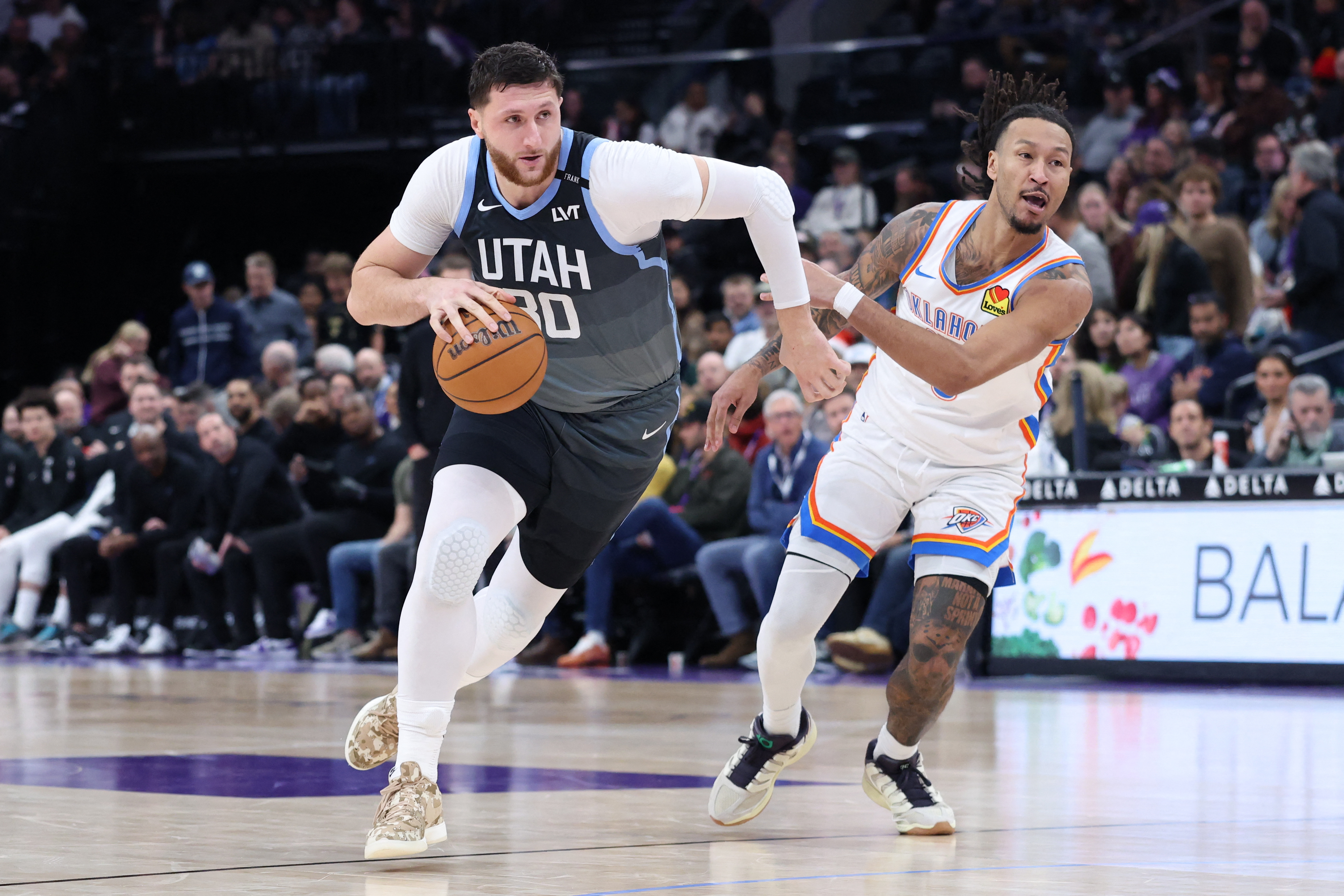 Dec 7, 2025; Salt Lake City, Utah, USA; Utah Jazz center Jusuf Nurkic (30) drives to the basket against Oklahoma City Thunder forward Jaylin Williams (6) during the second half at Delta Center. Mandatory Credit: Rob Gray-Imagn Images