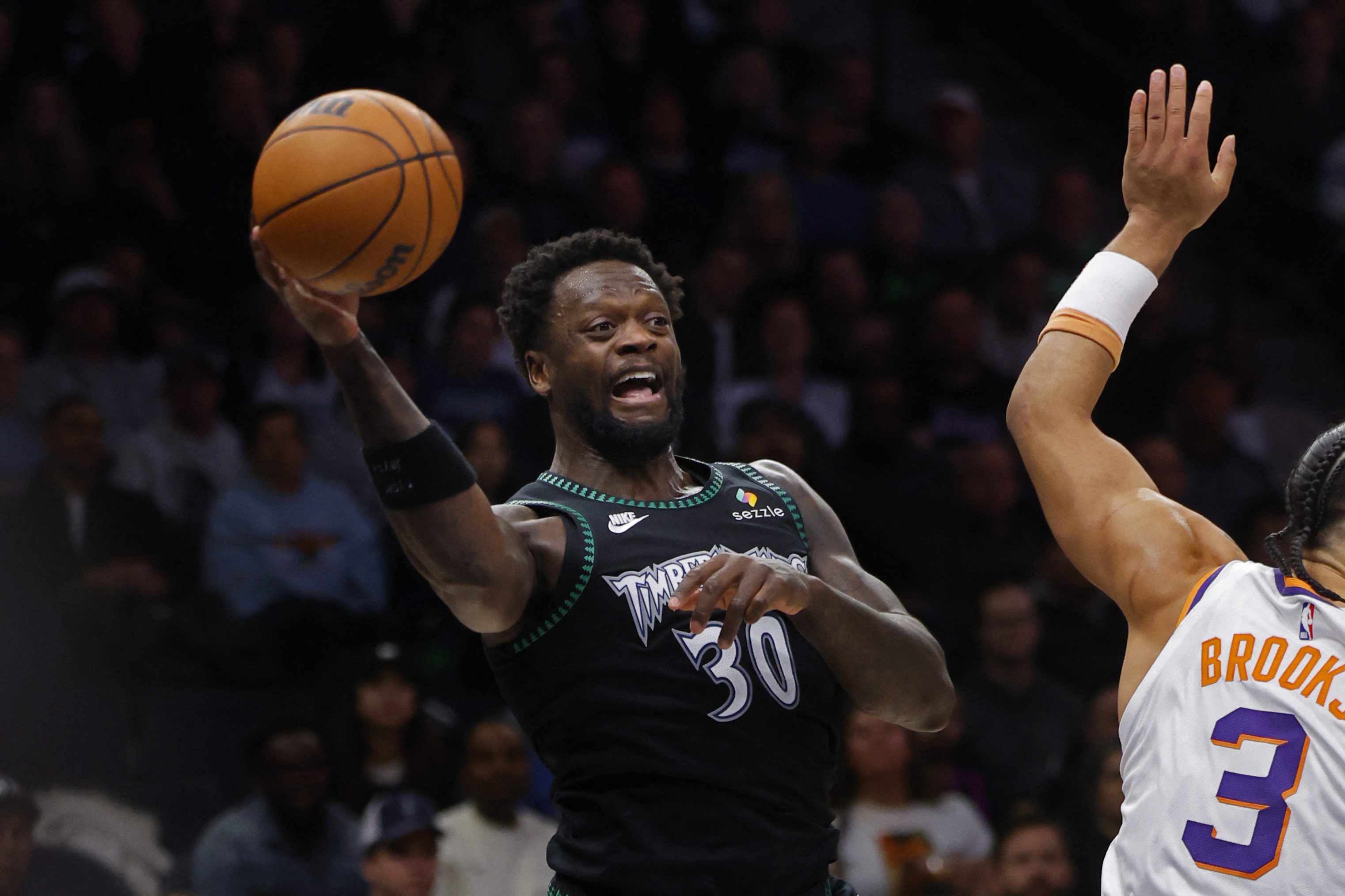 Dec 8, 2025; Minneapolis, Minnesota, USA; Minnesota Timberwolves forward Julius Randle (30) passes against the Phoenix Suns in the third quarter at Target Center. Mandatory Credit: Bruce Kluckhohn-Imagn Images
