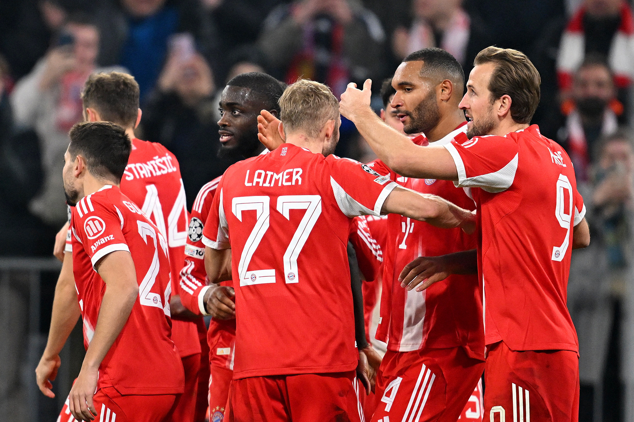 Soccer Football - UEFA Champions League - Bayern Munich v Sporting CP - Allianz Arena, Munich, Germany - December 9, 2025 Bayern Munich's Jonathan Tah celebrates scoring their third goal with teammates REUTERS/Angelika Warmuth