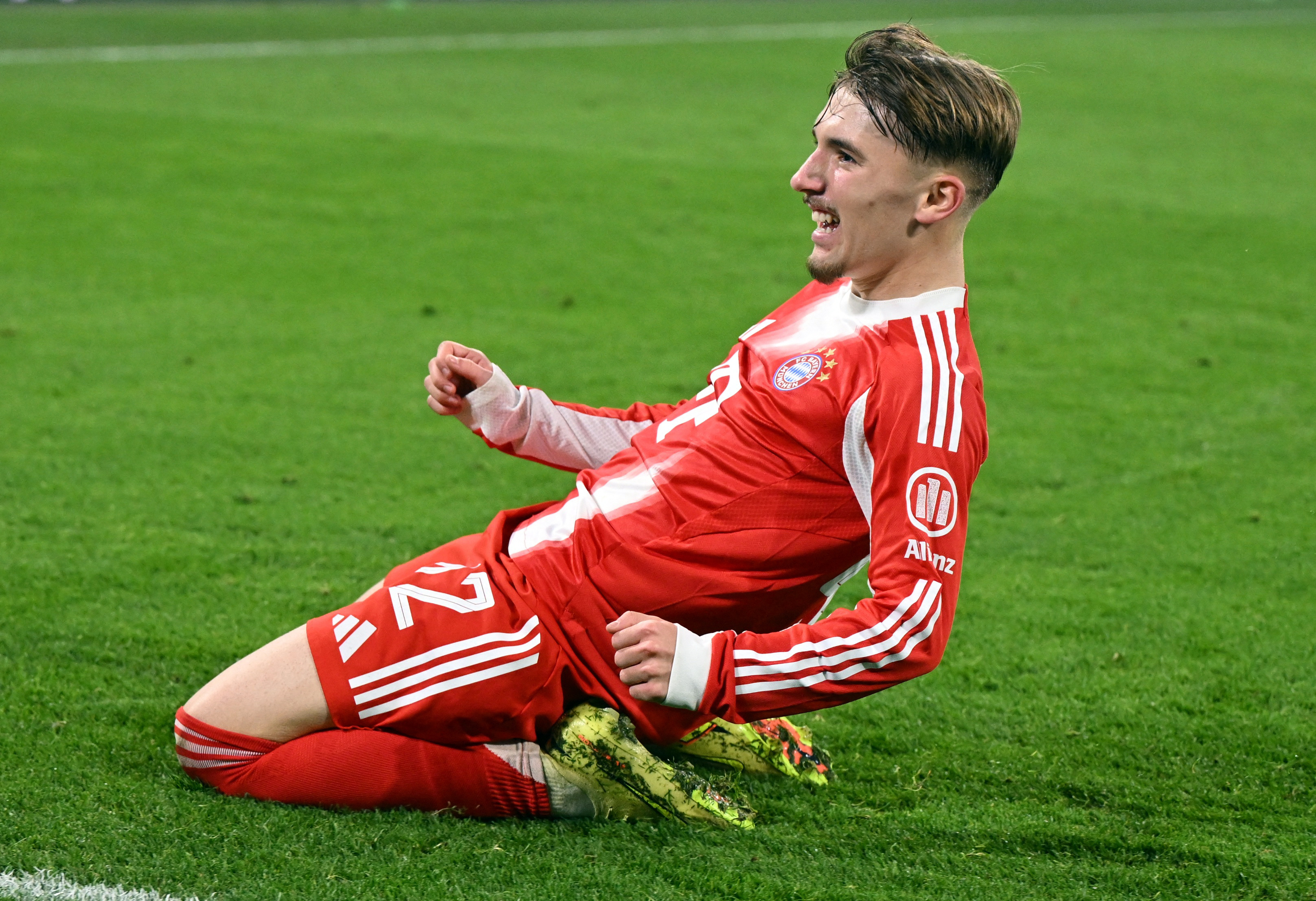 Soccer Football - UEFA Champions League - Bayern Munich v Sporting CP - Allianz Arena, Munich, Germany - December 9, 2025 Bayern Munich's Lennart Karl celebrates scoring their second goal REUTERS/Angelika Warmuth
