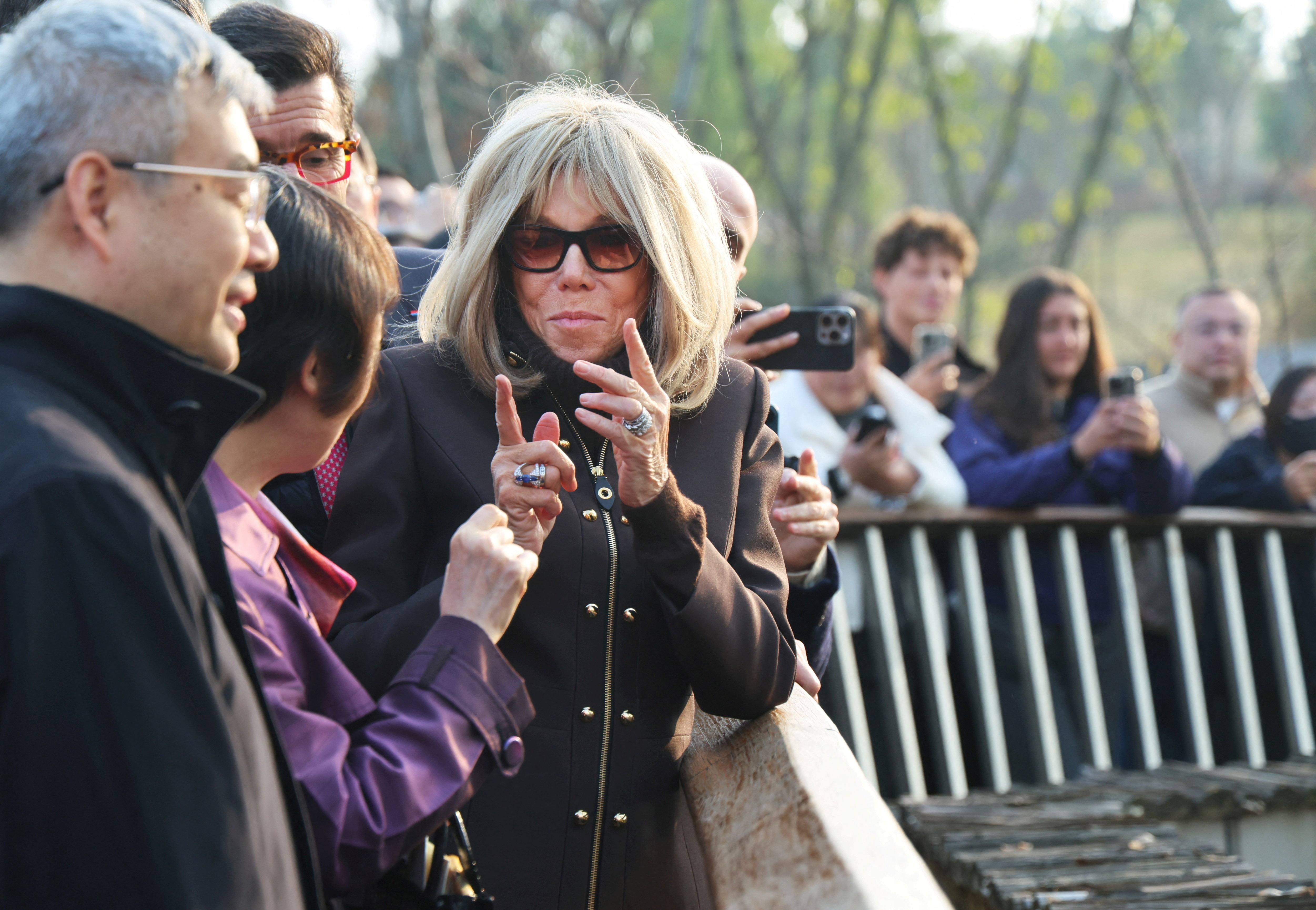 Brigitte Macron gestures during her visit to the Chengdu research base for giant panda breeding, China, December 5, 2025. LUDOVIC MARIN/Pool via REUTERS