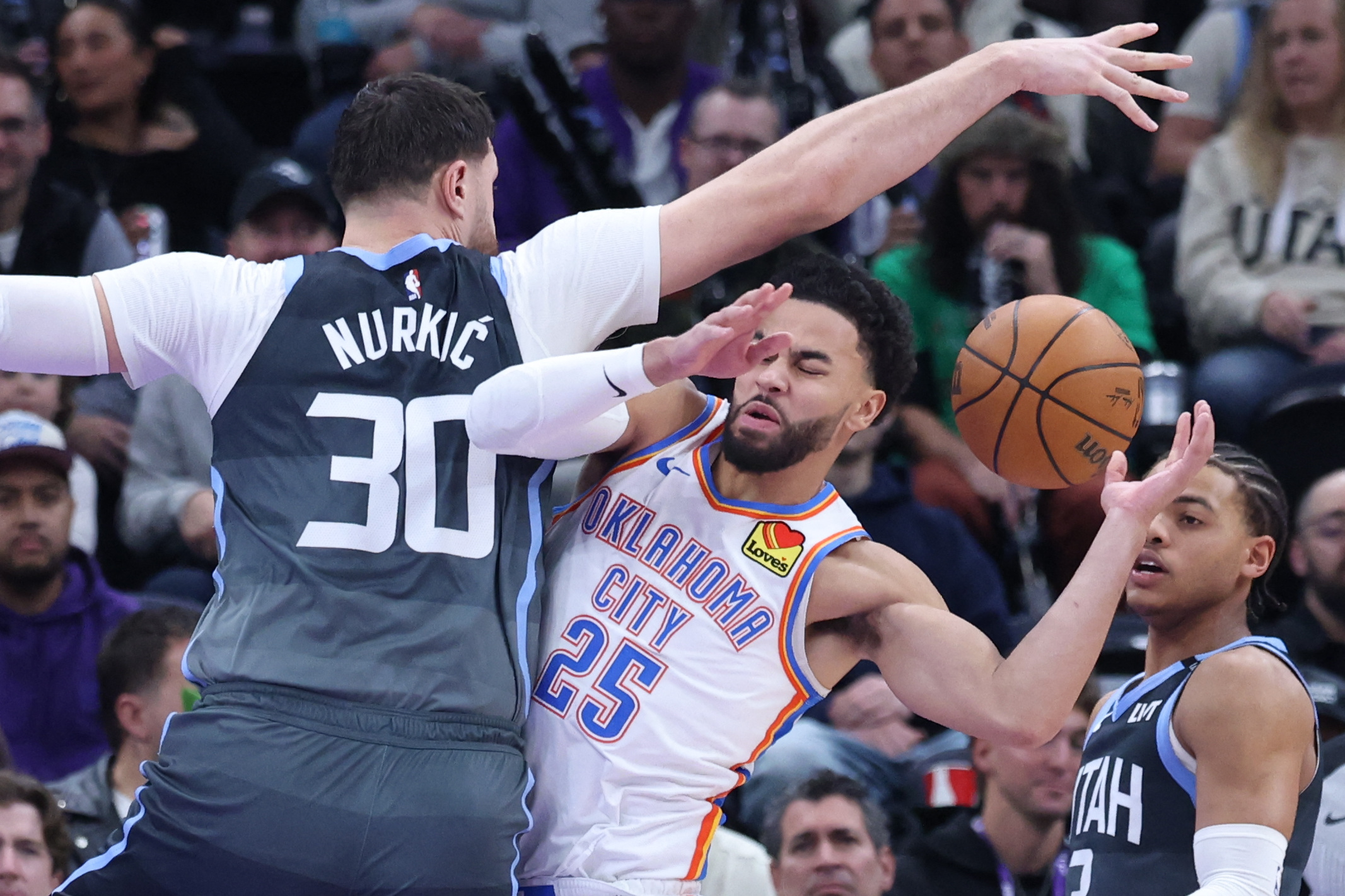 Dec 7, 2025; Salt Lake City, Utah, USA; Oklahoma City Thunder guard Ajay Mitchell (25) runs into Utah Jazz center Jusuf Nurkic (30) during a play in the second half at Delta Center. Mandatory Credit: Rob Gray-Imagn Images
