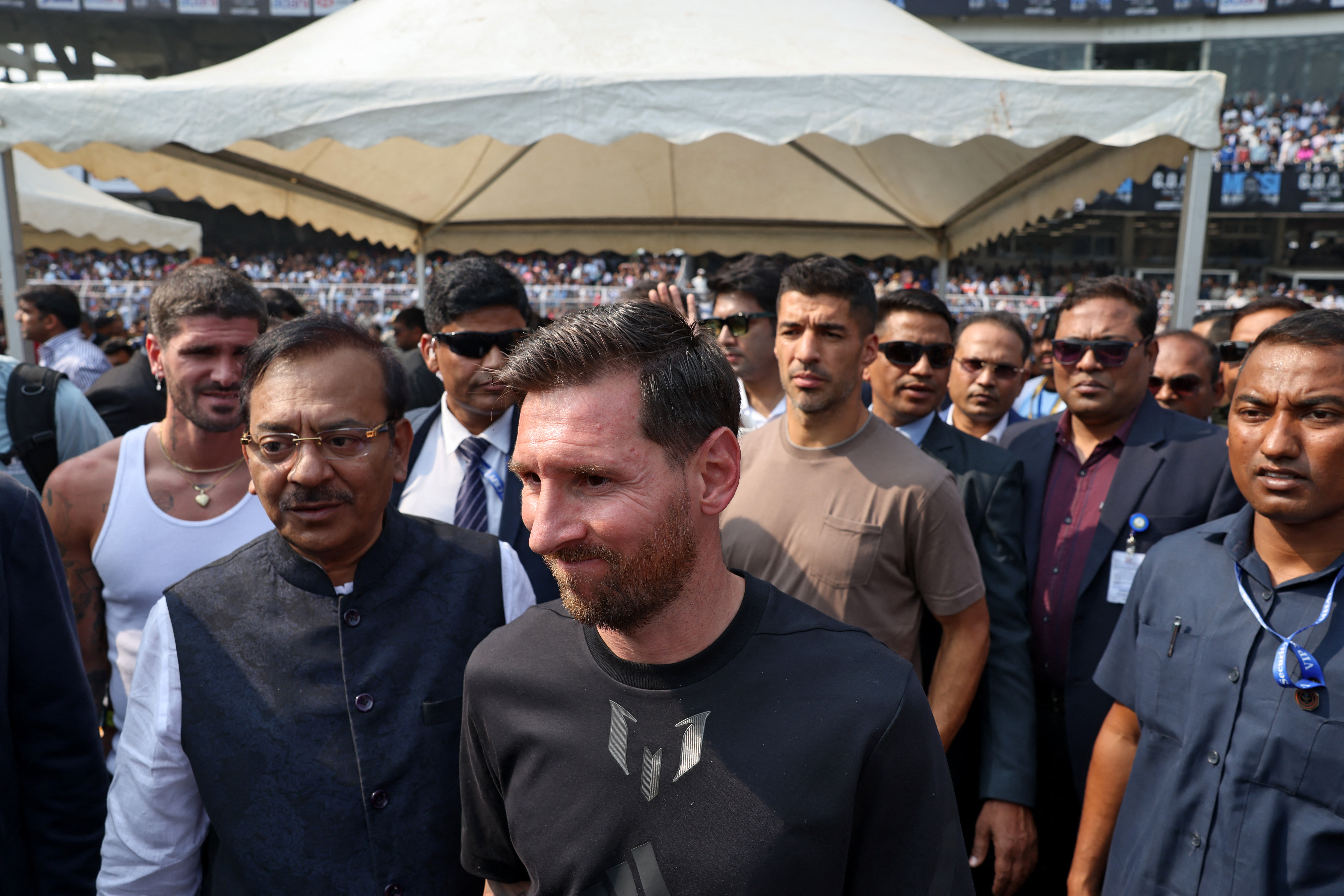 Soccer Football - Argentine soccer star Lionel Messi on a whirlwind tour of India - Vivekananda Yuva Bharati Krirangan, Kolkata, India - December 13, 2025 Argentine soccer star Lionel Messi with his Inter Miami teammates Rodrigo De Paul and Luis Suarez at