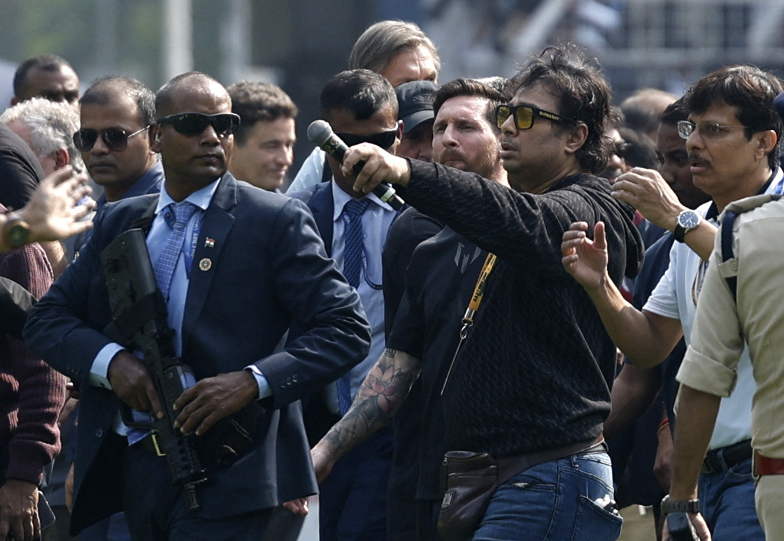 Soccer Football - Argentine soccer star Lionel Messi on a whirlwind tour of India - Vivekananda Yuva Bharati Krirangan, Kolkata, India - December 13, 2025 Argentine soccer star Lionel Messi and organiser Satadru Dutta at the stadium during his tour of Ind