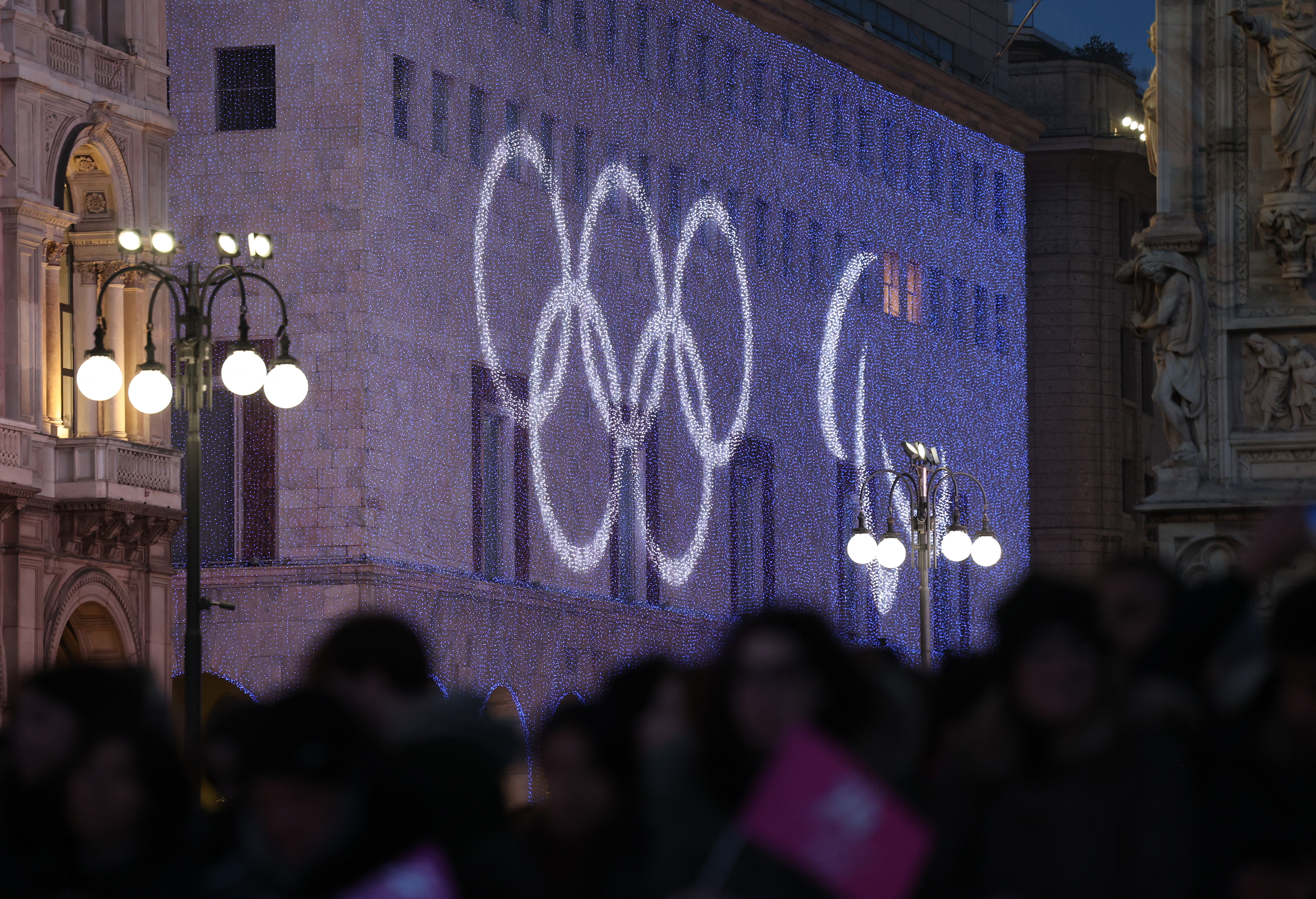 Winter Olympics - Christmas tree for 2026 Milano-Cortina Winter Olympics lit up in Milan - Piazza del Duomo, Milan, Italy - December 6, 2025 General view of the Olympic rings outside the Piazza del Duomo ahead of the lighting of the Christmas tree for 202