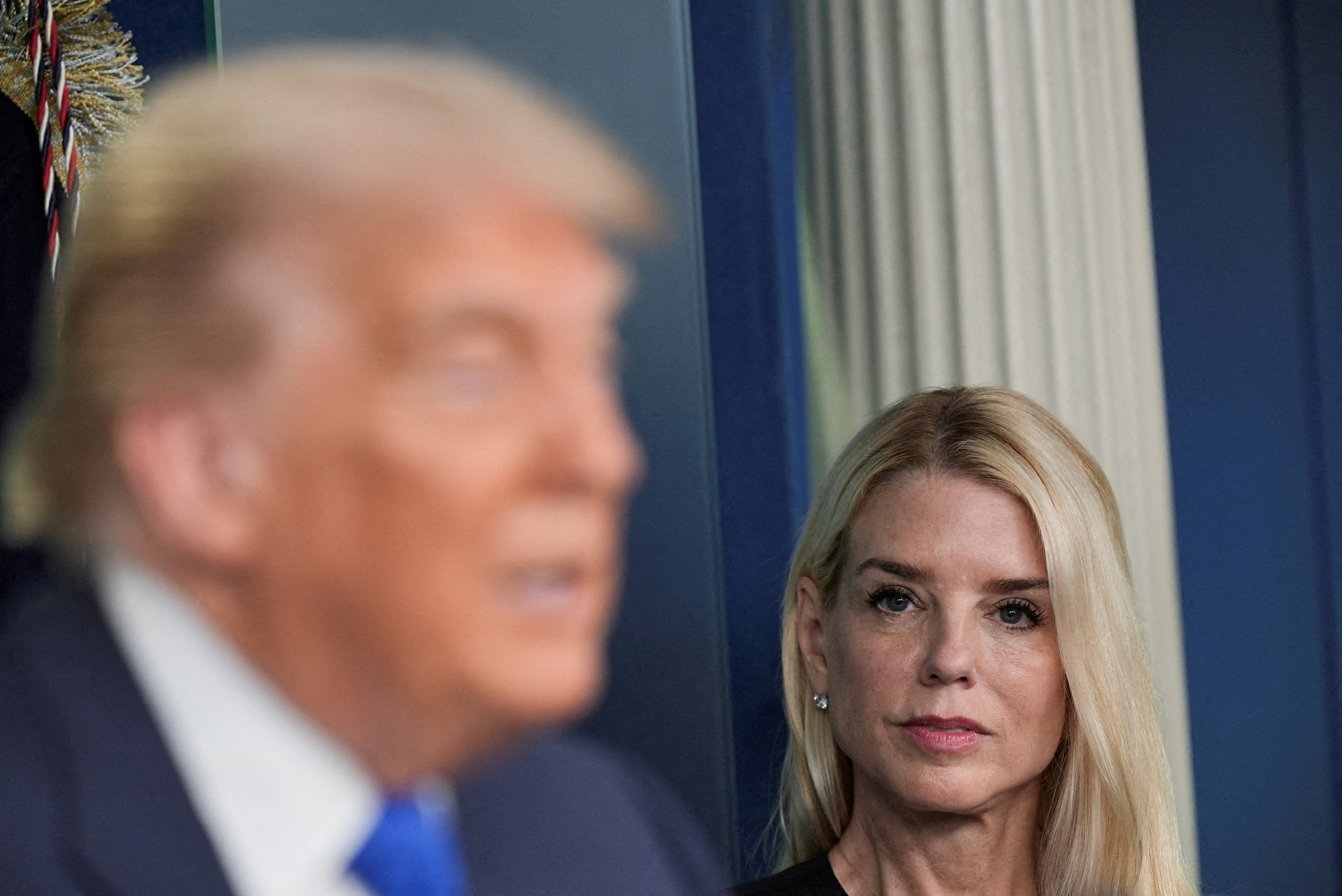 FILE PHOTO: U.S. Attorney General Pam Bondi listens as U.S. President