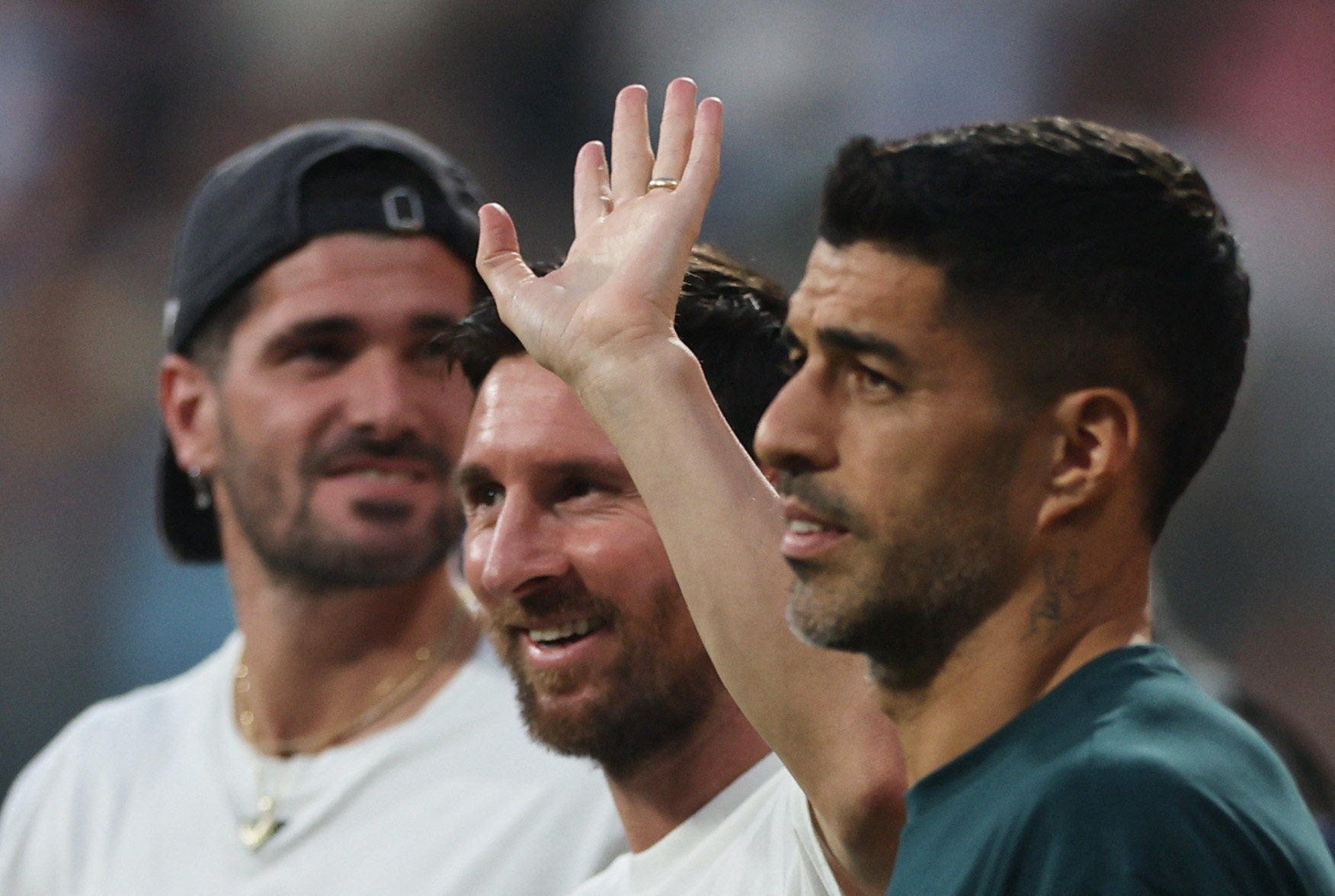 Soccer Football - Lionel Messi Tour of India - Wankhede Stadium, Mumbai, India - December 14, 2025 Argentina and Inter Miami's Lionel Messi with his Inter Miami teammates Rodrigo De Paul and Luis Suarez at the stadium during his tour of India REUTERS/Fran