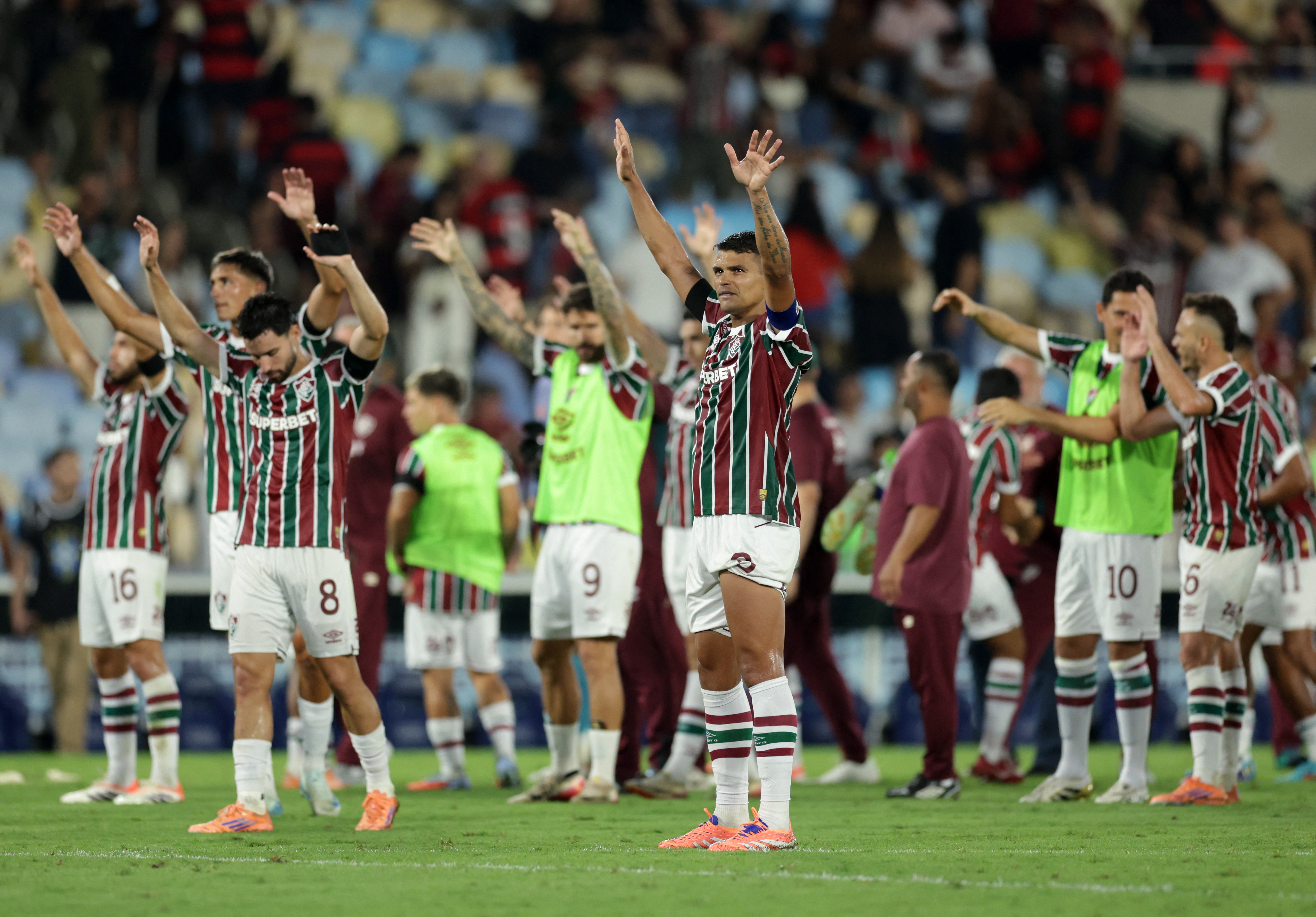 Soccer Football - Brasileiro Championship - Fluminense v Flamengo - Estadio Maracana, Rio de Janeiro, Brazil - November 19, 2025 Fluminense's Thiago Silva celebrates with teammates after the match REUTERS/Ricardo Moraes