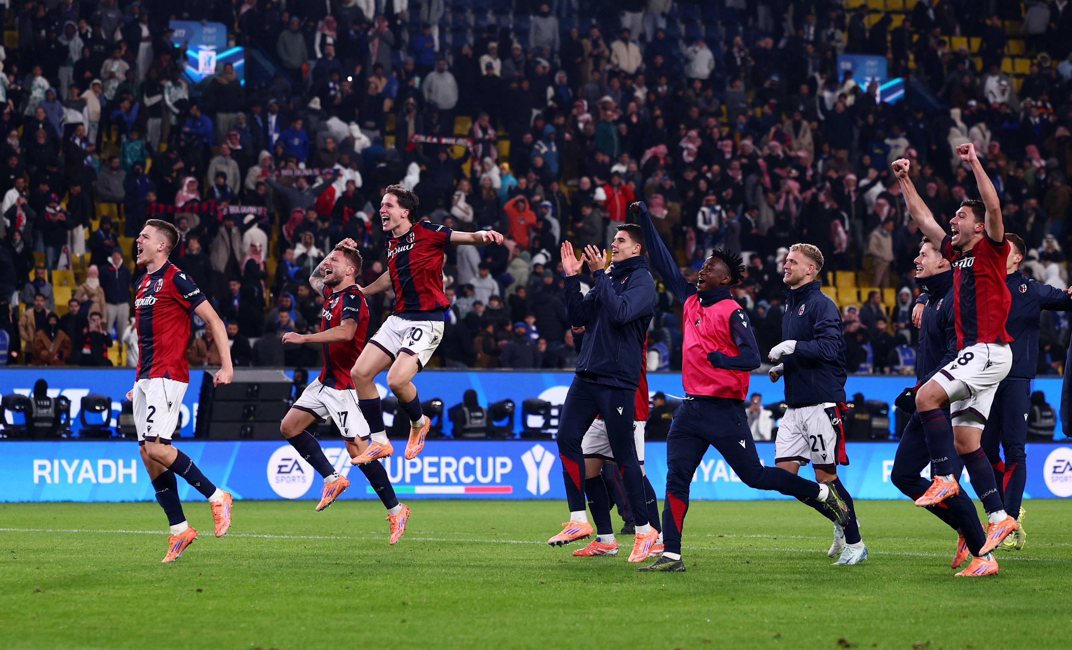 Soccer Football - Supercoppa Italiana - Semi Final - Bologna v Inter Milan - Al Awwal Park, Riyadh, Saudi Arabia - December 20, 2025 Bologna's Emil Holm, Ciro Immobile, Giovanni Fabbian with teammates celebrate after the match REUTERS/Guglielmo Mangiapane