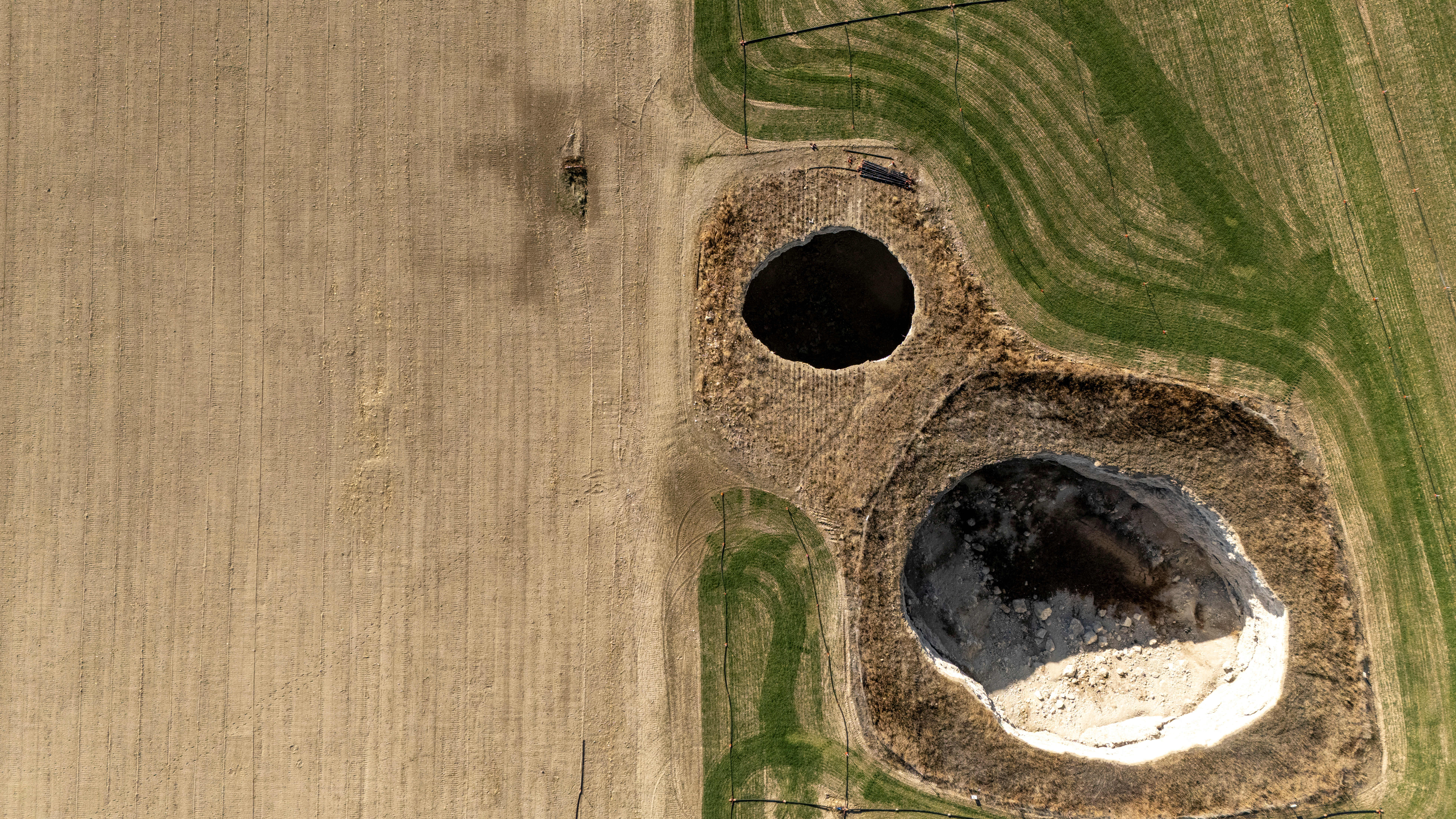 A drone view shows sinkholes formed in the middle of a farmland in Konya province, Turkey, December 18, 2025. REUTERS/Umit Bektas     TPX IMAGES OF THE DAY