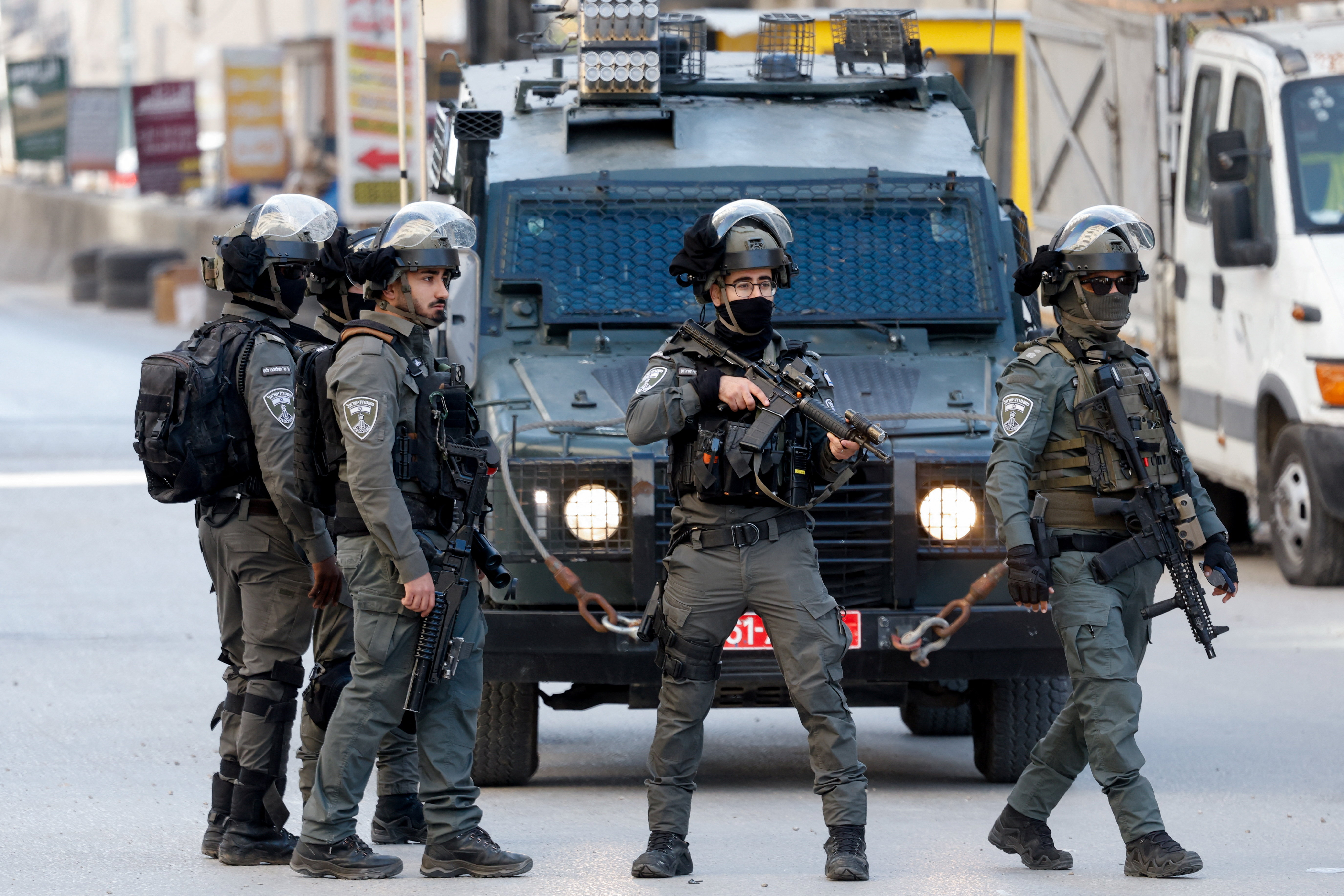 Members of Israeli forces take part in an Israeli raid in Qalandya