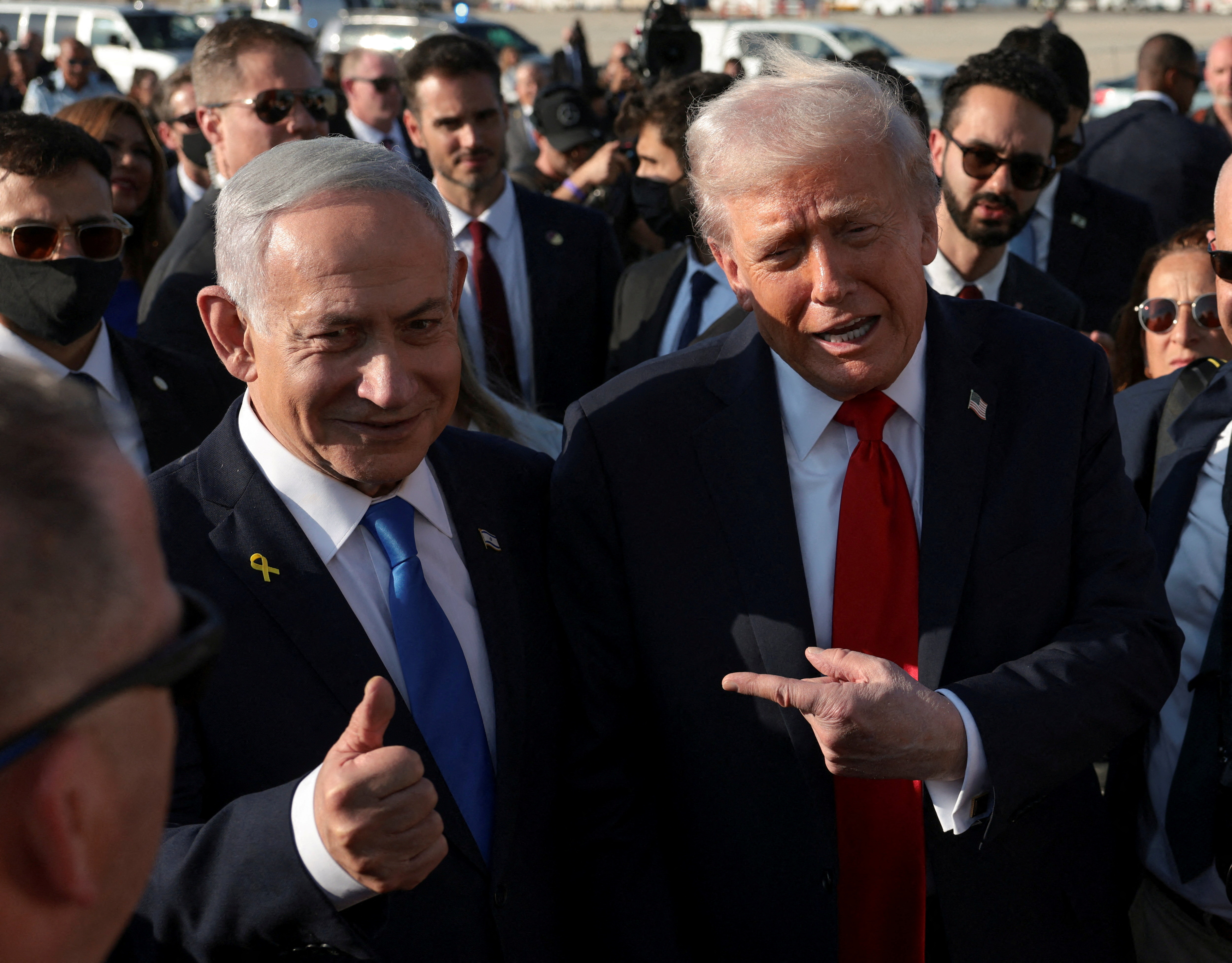 FILE PHOTO: U.S. President Donald Trump  gestures next to Israeli Prime Minister
