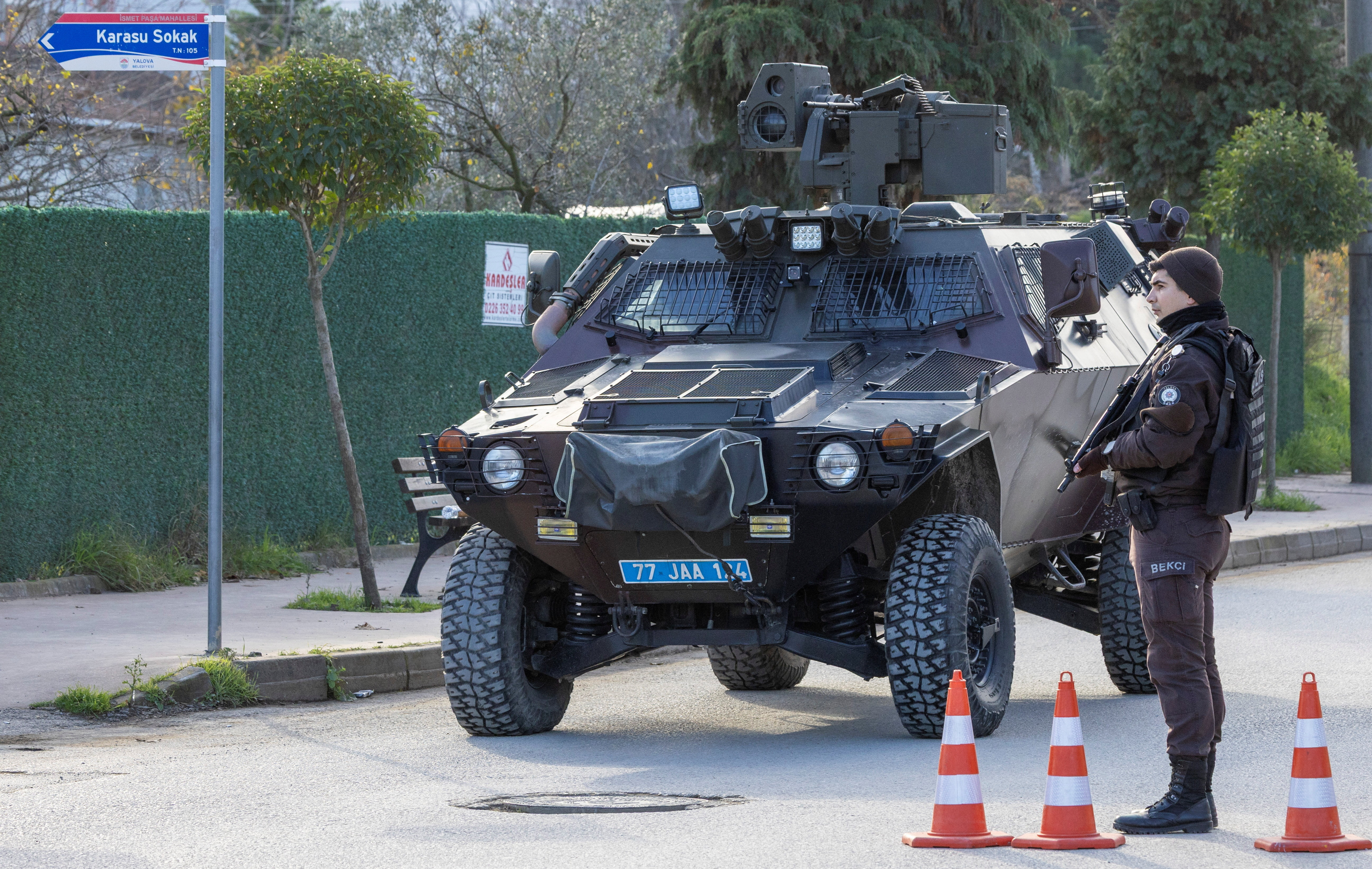 An armoured Turkish gendarmerie vehicle leaves the site where Turkish security forces launched an operation on a house believed to contain suspected Islamic State militants