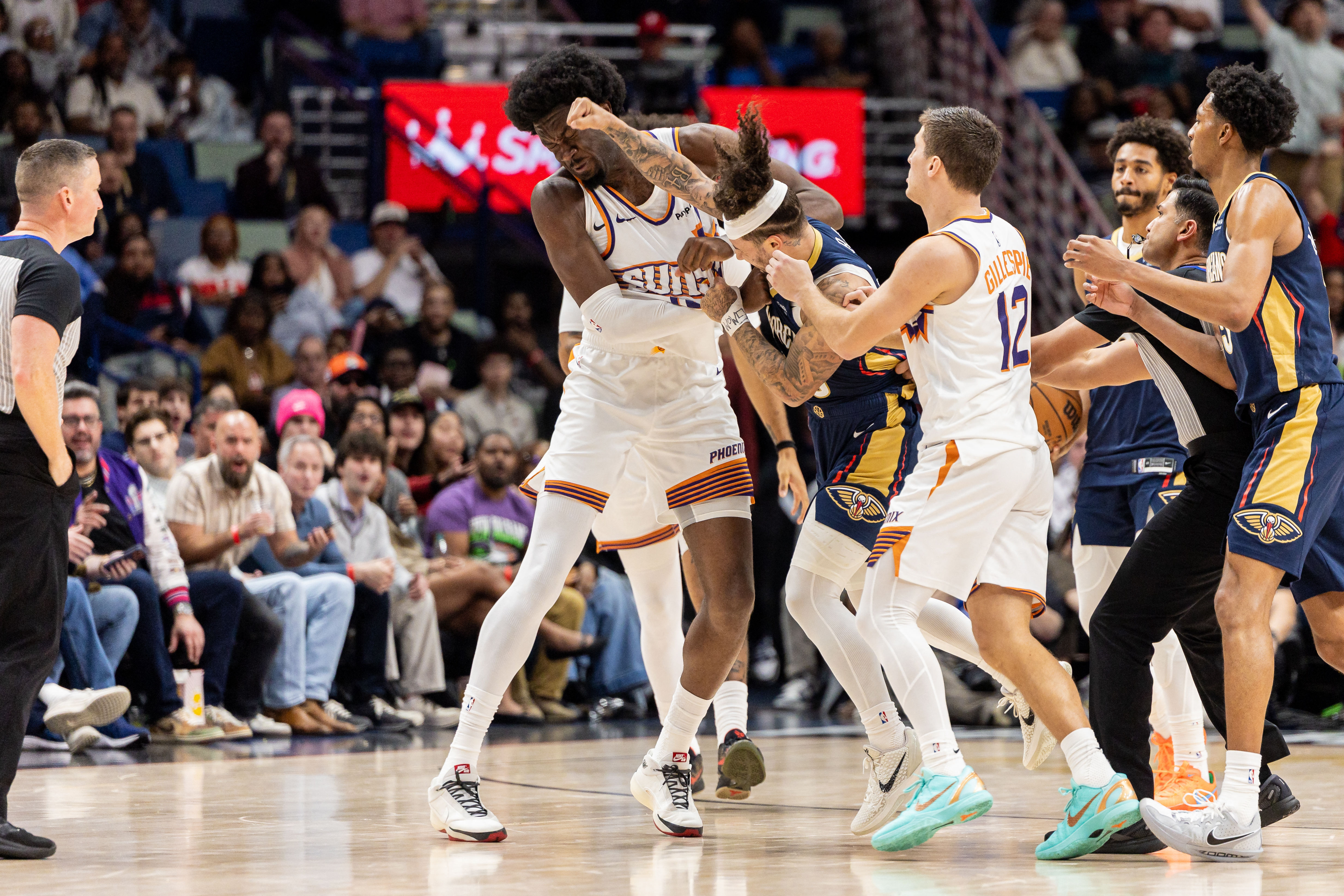 Dec 27, 2025; New Orleans, Louisiana, USA;  New Orleans Pelicans guard Jose Alvarado (15) gets into a scrum with Phoenix Suns center Mark Williams (15) over a play during the second half at Smoothie King Center. Mandatory Credit: Stephen Lew-Imagn Images