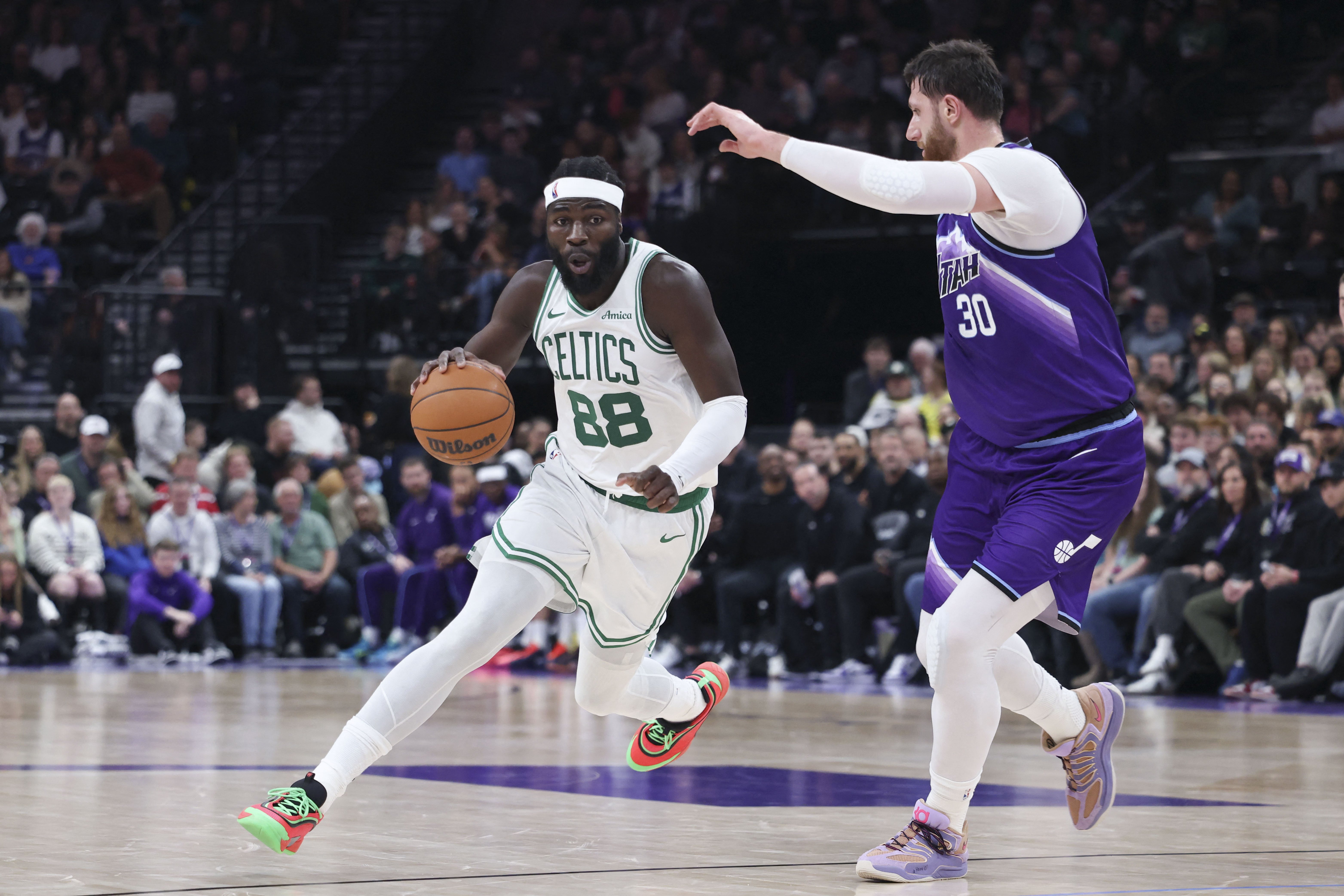Dec 30, 2025; Salt Lake City, Utah, USA; Boston Celtics center Neemias Queta (88) drives against Utah Jazz center Jusuf Nurkic (30) during the first half at Delta Center. Mandatory Credit: Rob Gray-Imagn Images