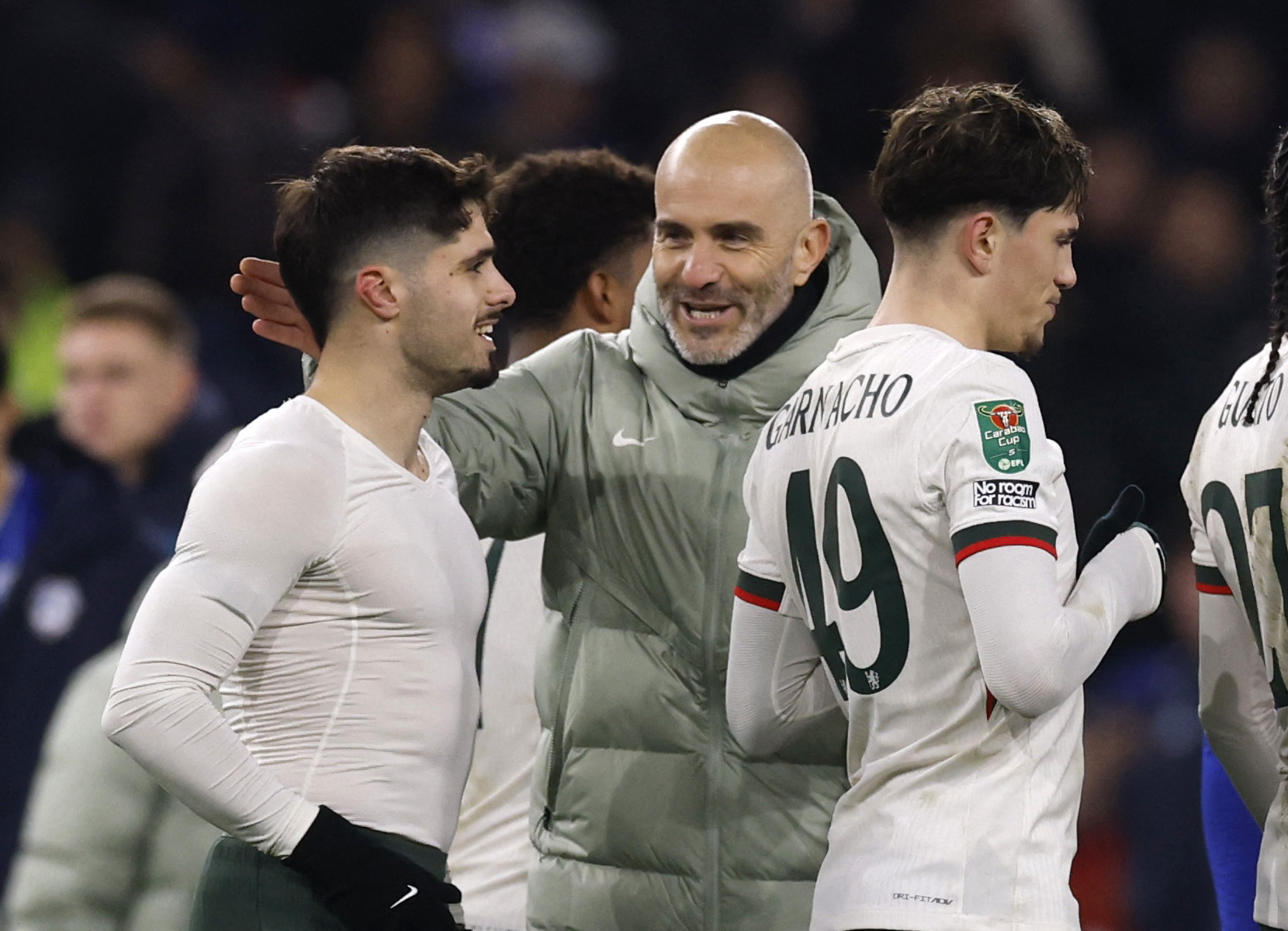 Soccer Football - Carabao Cup - Quarter Final - Cardiff City v Chelsea - Cardiff City Stadium, Cardiff, Wales, Britain - December 16, 2025 Chelsea manager Enzo Maresca celebrates after the match with Pedro Neto and Alejandro Garnacho Action Images via Reu