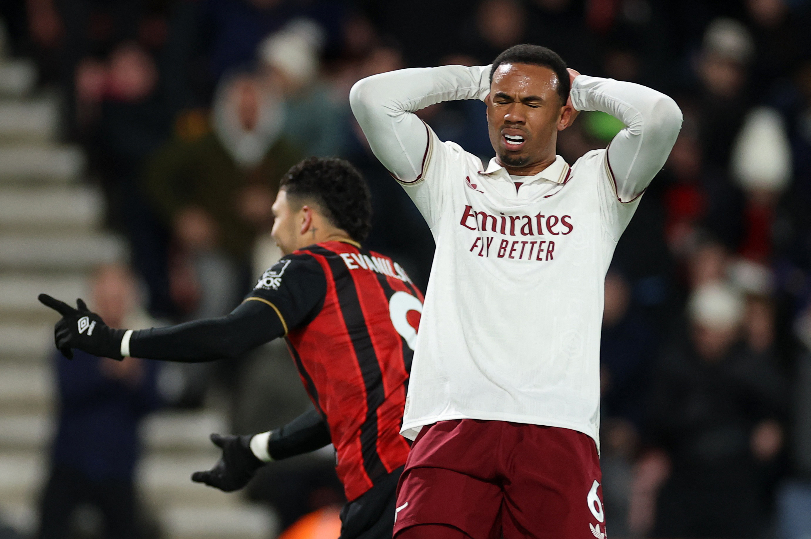 Soccer Football - Premier League - AFC Bournemouth v Arsenal - Vitality Stadium, Bournemouth, Britain - January 3, 2026 AFC Bournemouth's Evanilson celebrates scoring their first goal as Arsenal's Gabriel Magalhaes looks dejected REUTERS/Toby Melville EDI