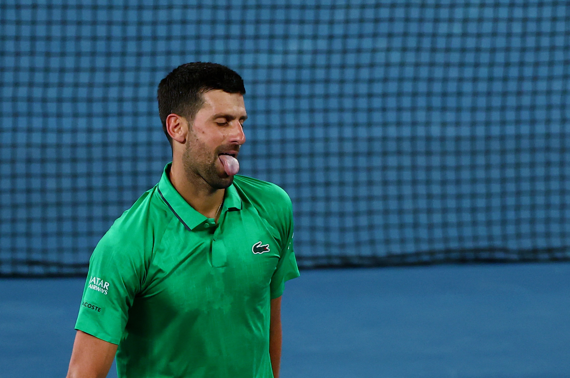 Tennis - Australian Open - Melbourne Park, Melbourne, Australia - January 19, 2026 Serbia's Novak Djokovic reacts during his first round match against Spain's Pedro Martinez REUTERS/Tingshu Wang