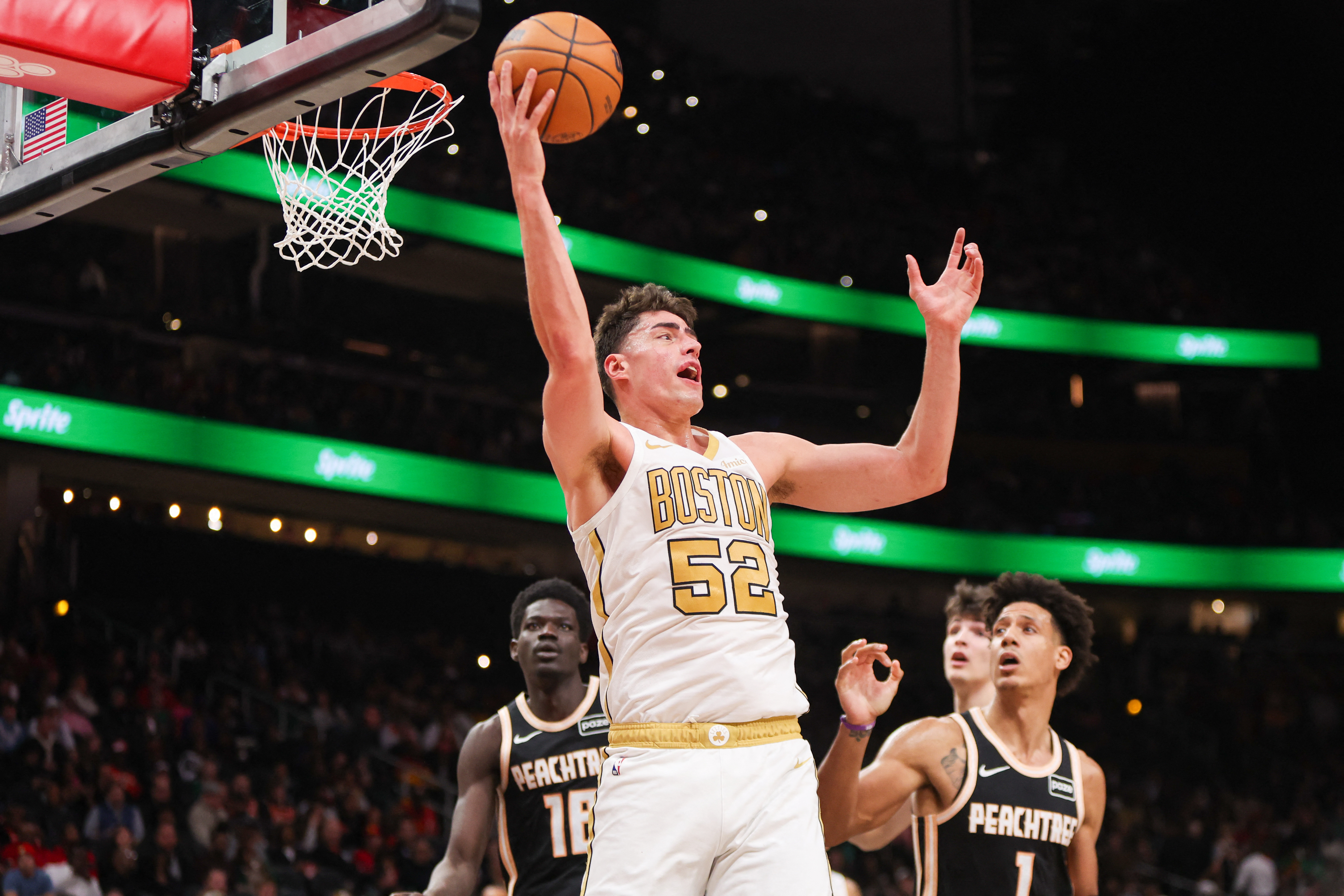 Jan 17, 2026; Atlanta, Georgia, USA; Boston Celtics center Luka Garza (52) grabs a rebound against the Atlanta Hawks in the third quarter at State Farm Arena. Mandatory Credit: Brett Davis-Imagn Images