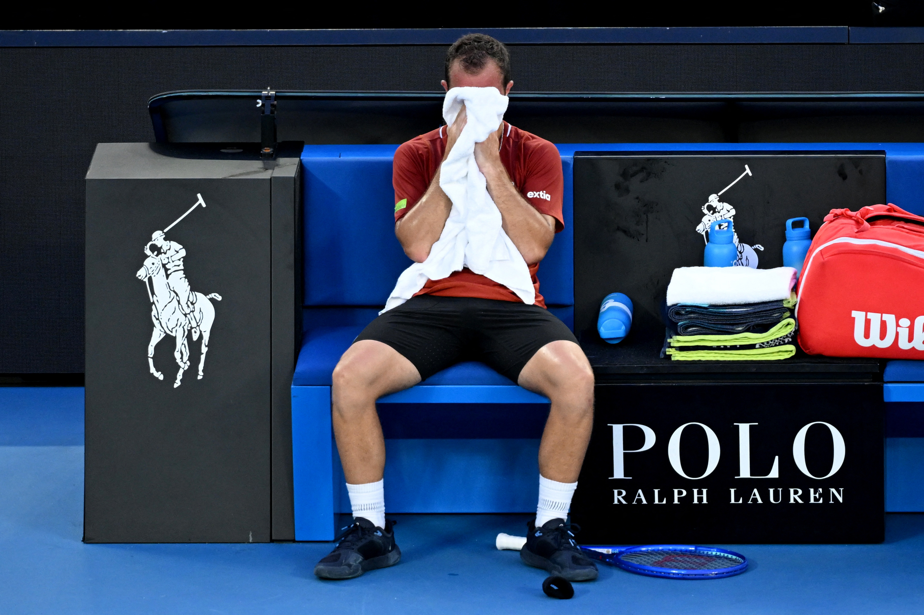 Tennis - Australian Open - Melbourne Park, Melbourne, Australia - January 20, 2026 France's Hugo Gaston reacts after retiring from his first round match against Italy's Jannik Sinner REUTERS/Jaimi Joy