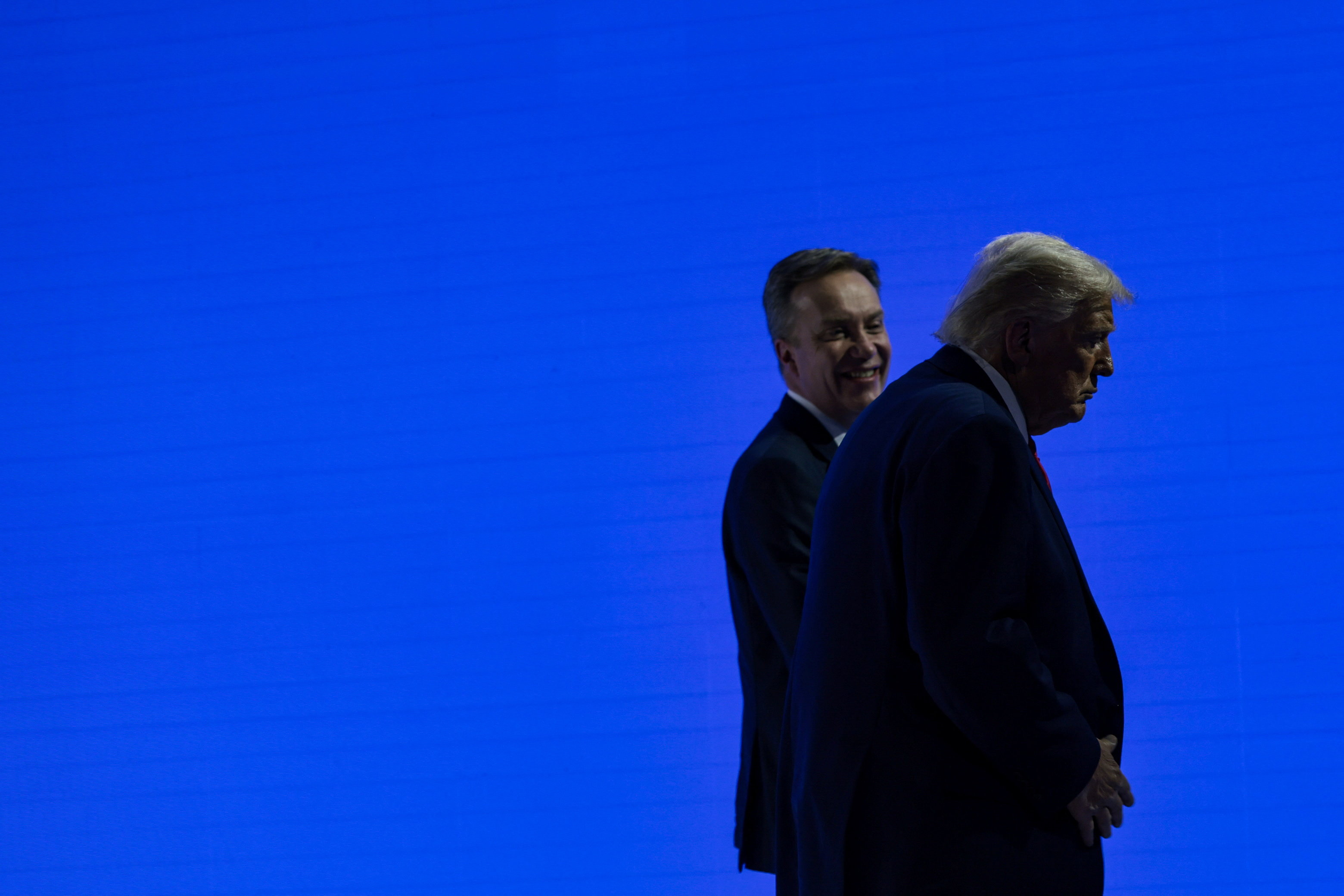 U.S. President Donald Trump walks with the President