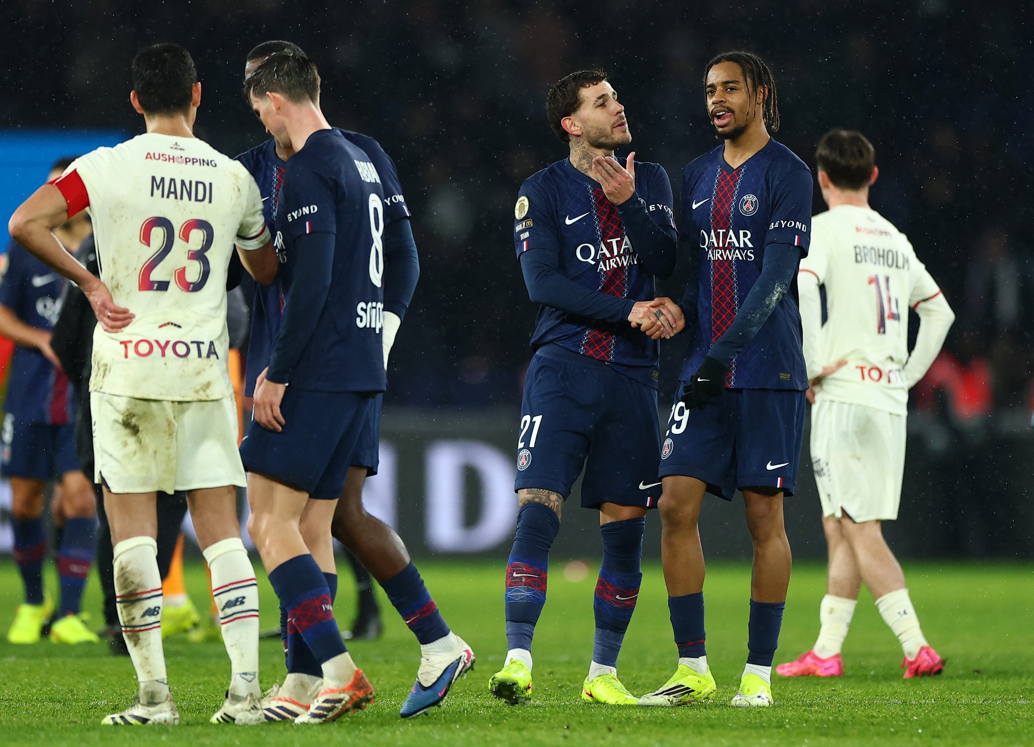 2026-01-Soccer Football - Ligue 1 - Paris St Germain v Lille - Parc des Princes, Paris, France - January 16, 2026 Paris St Germain's Bradley Barcola and Paris St Germain's Lucas Hernandez celebrate after the match REUTERS/Gonzalo Fuentes-FRANCE-PSG-LIL