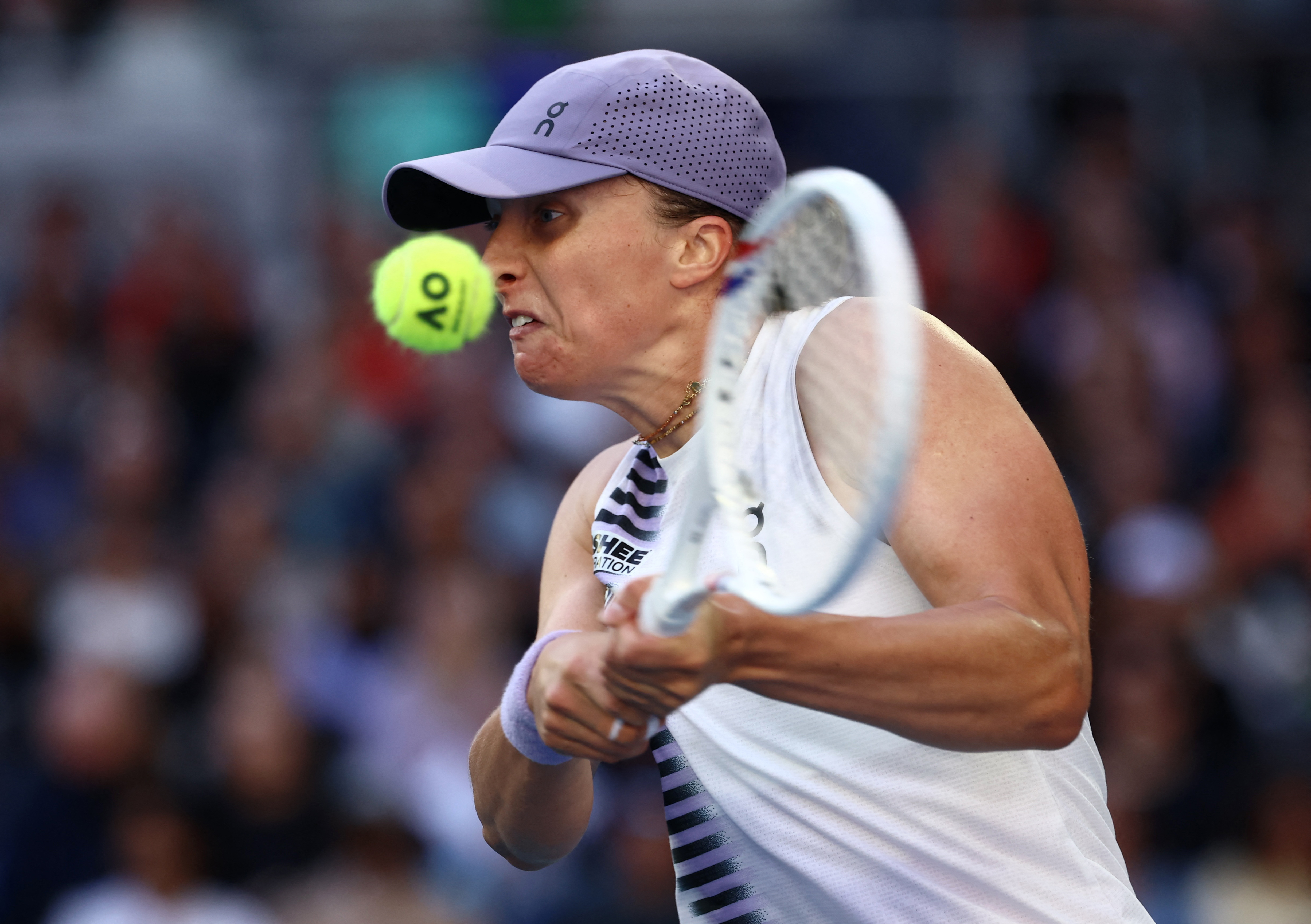 Tennis - Australian Open - Melbourne Park, Melbourne, Australia - January 22, 2026 Poland's Iga Swiatek in action during her second round match against Czech Republic's Marie Bouzkova REUTERS/Tingshu Wang