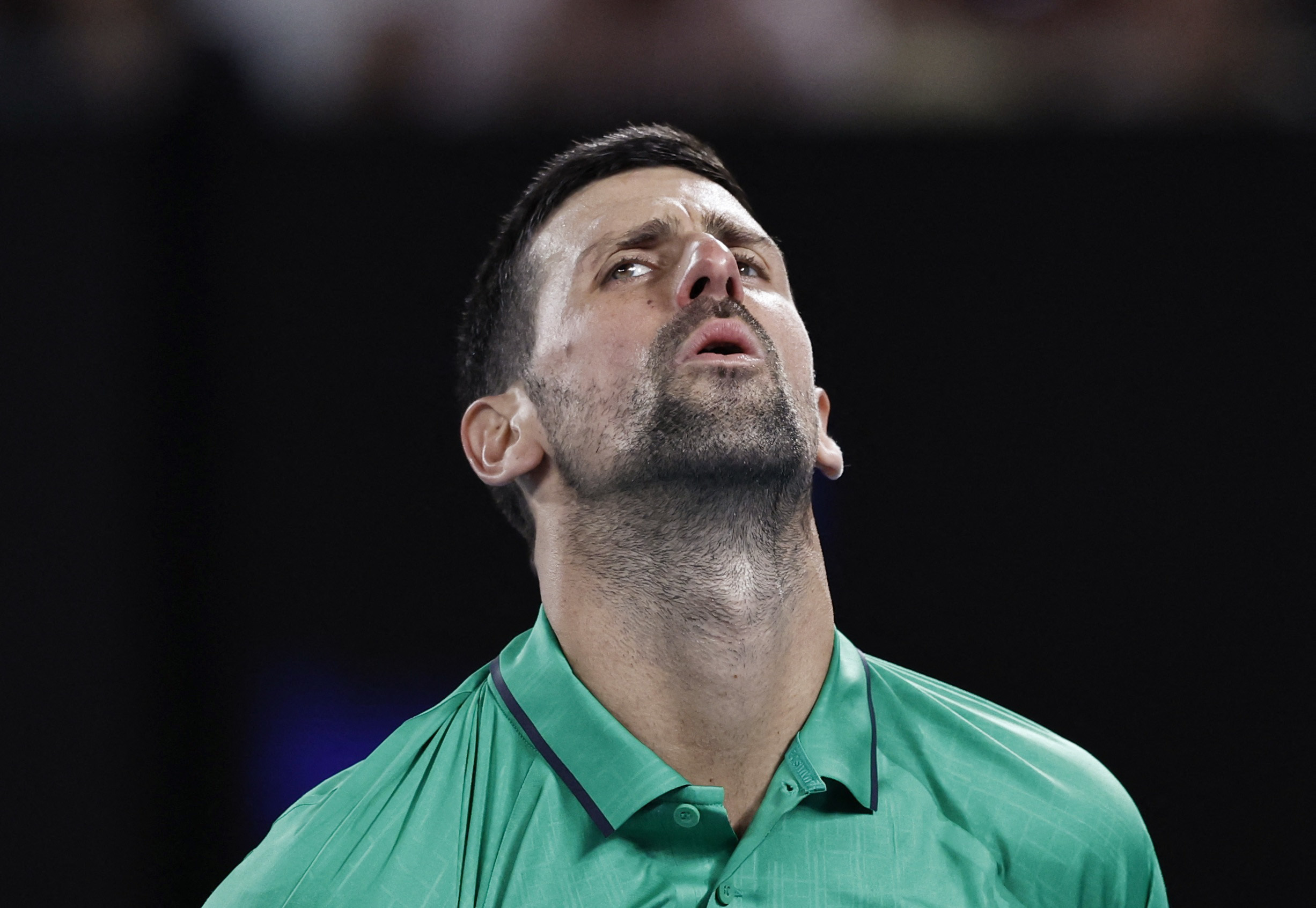 Tennis - Australian Open - Melbourne Park, Melbourne, Australia - January 24, 2026 Serbia's Novak Djokovic reacts during his third round match against Netherlands' Botic van de Zandschulp REUTERS/Tingshu Wang