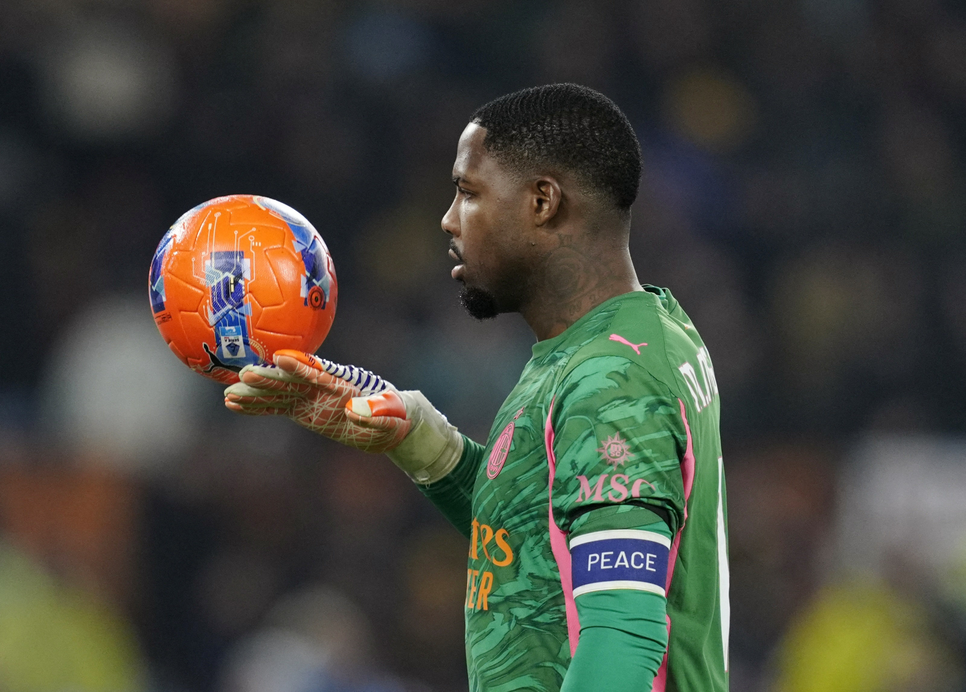 Soccer Football - Serie A - AS Roma v AC Milan - Stadio Olimpico, Rome, Italy - January 25, 2026 AC Milan's Mike Maignan with the match ball REUTERS/Matteo Ciambelli