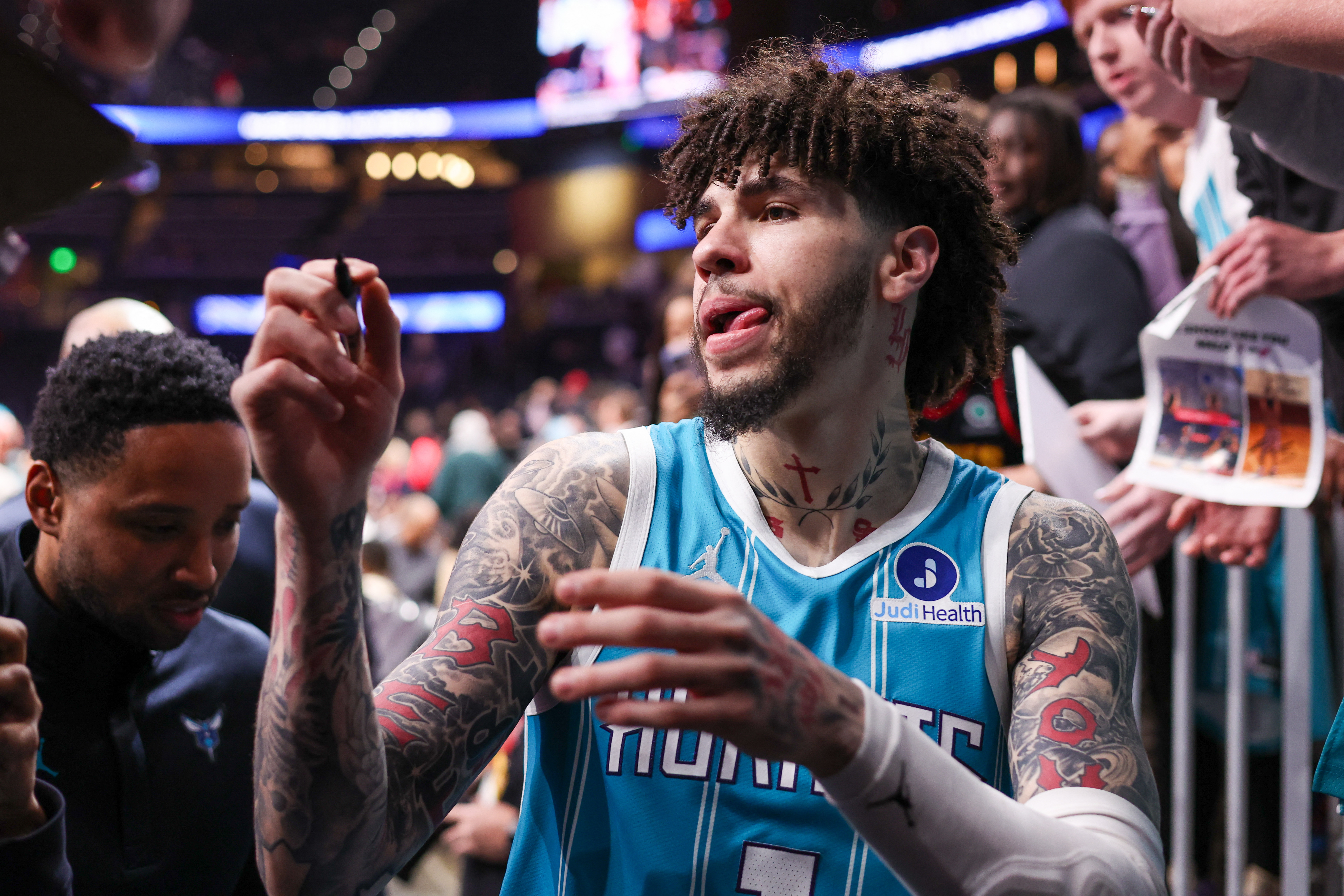 Feb 7, 2026; Atlanta, Georgia, USA; Charlotte Hornets guard LaMelo Ball (1) signs autographs for fans after a victory over the Atlanta Hawks at State Farm Arena. Mandatory Credit: Brett Davis-Imagn Images