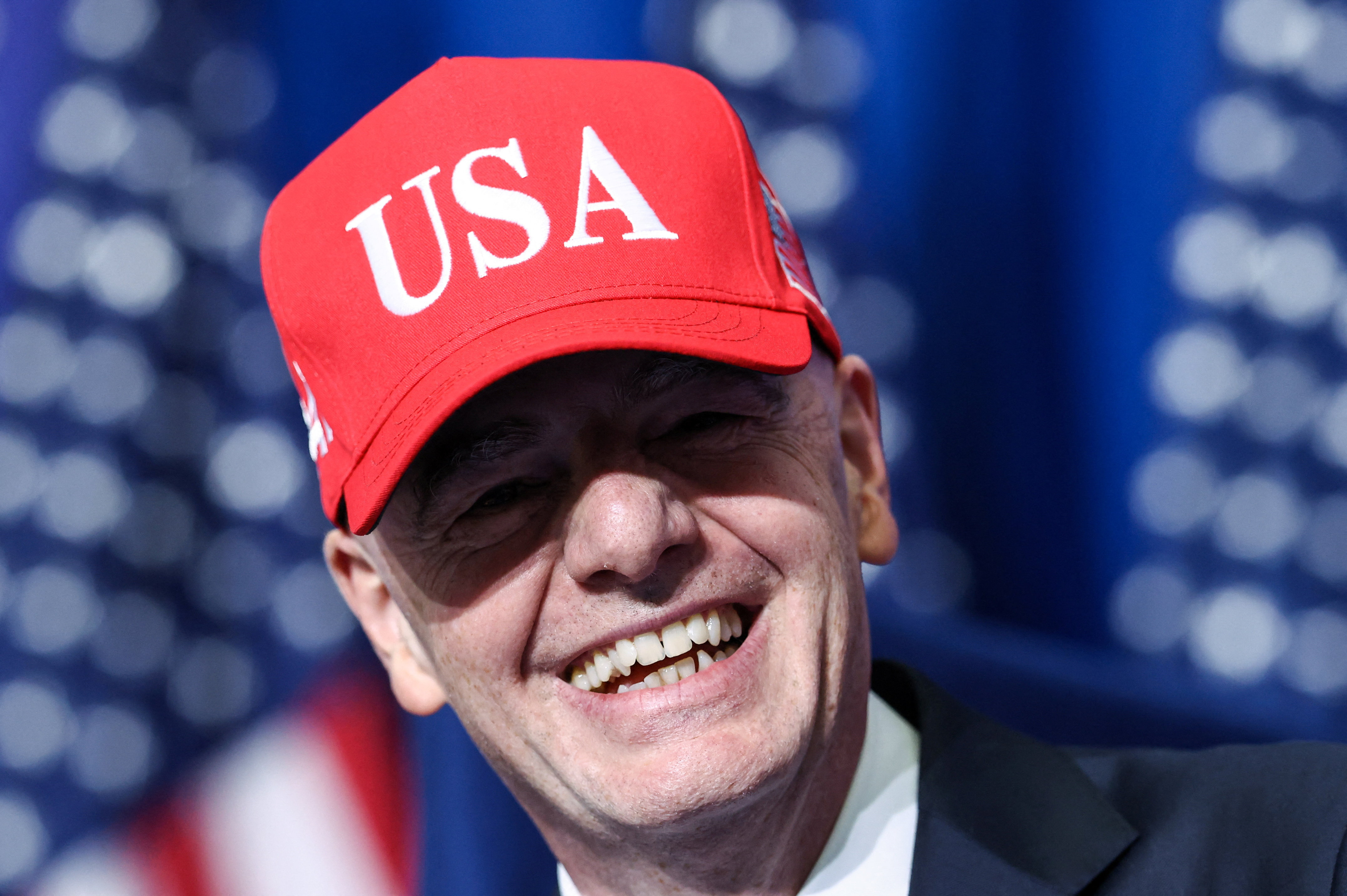FIFA president Gianni Infantino wears a USA hat as he attends the inaugural Board of Peace meeting at the U.S. Institute of Peace in Washington, D.C., U.S., February 19, 2026. REUTERS/Kevin Lamarque