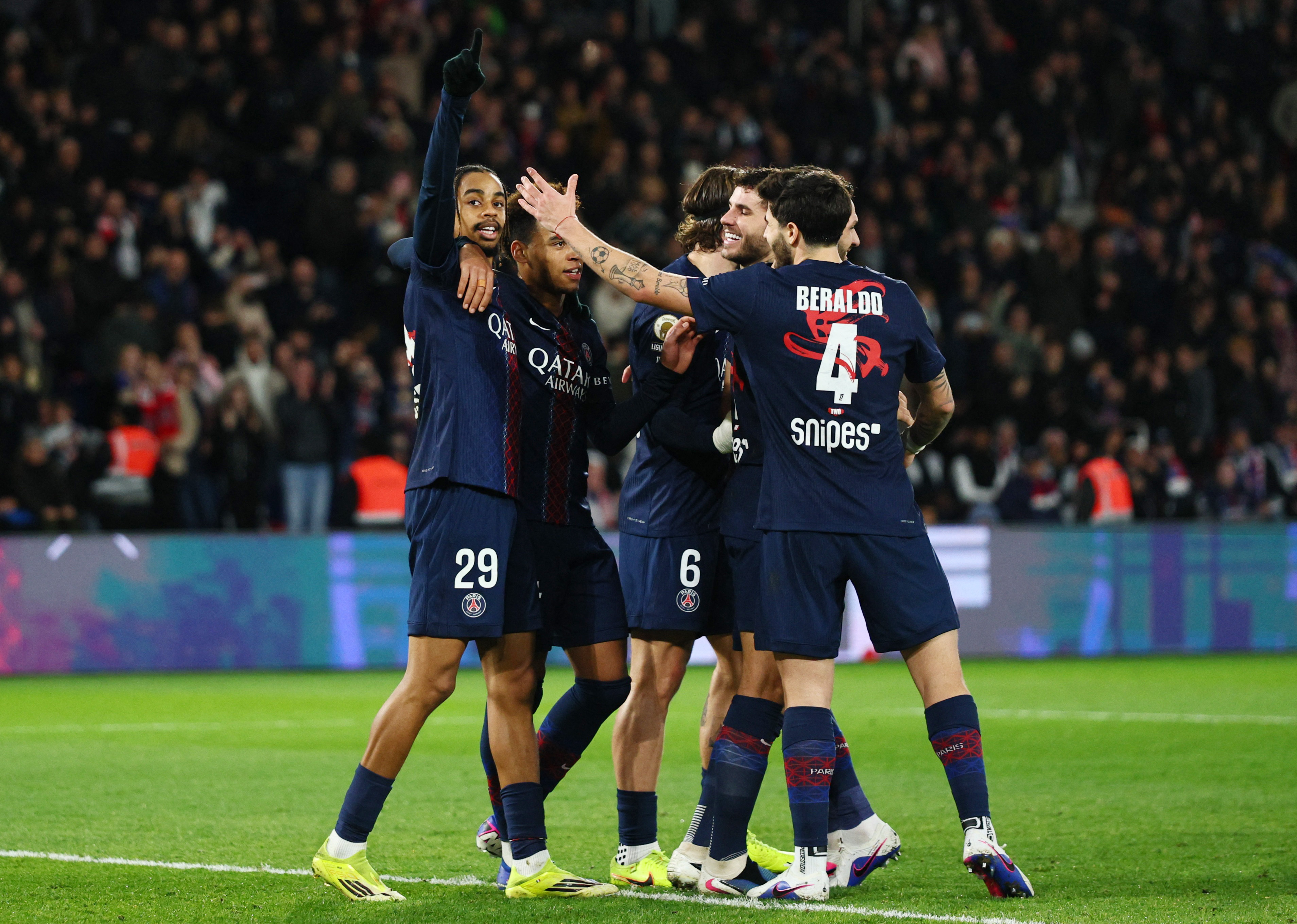 Soccer Football - Ligue 1 - Paris St Germain v FC Metz - Parc des Princes, Paris, France - February 21, 2026 Paris St Germain's Bradley Barcola celebrates scoring their second goal with teammates REUTERS/Manon Cruz