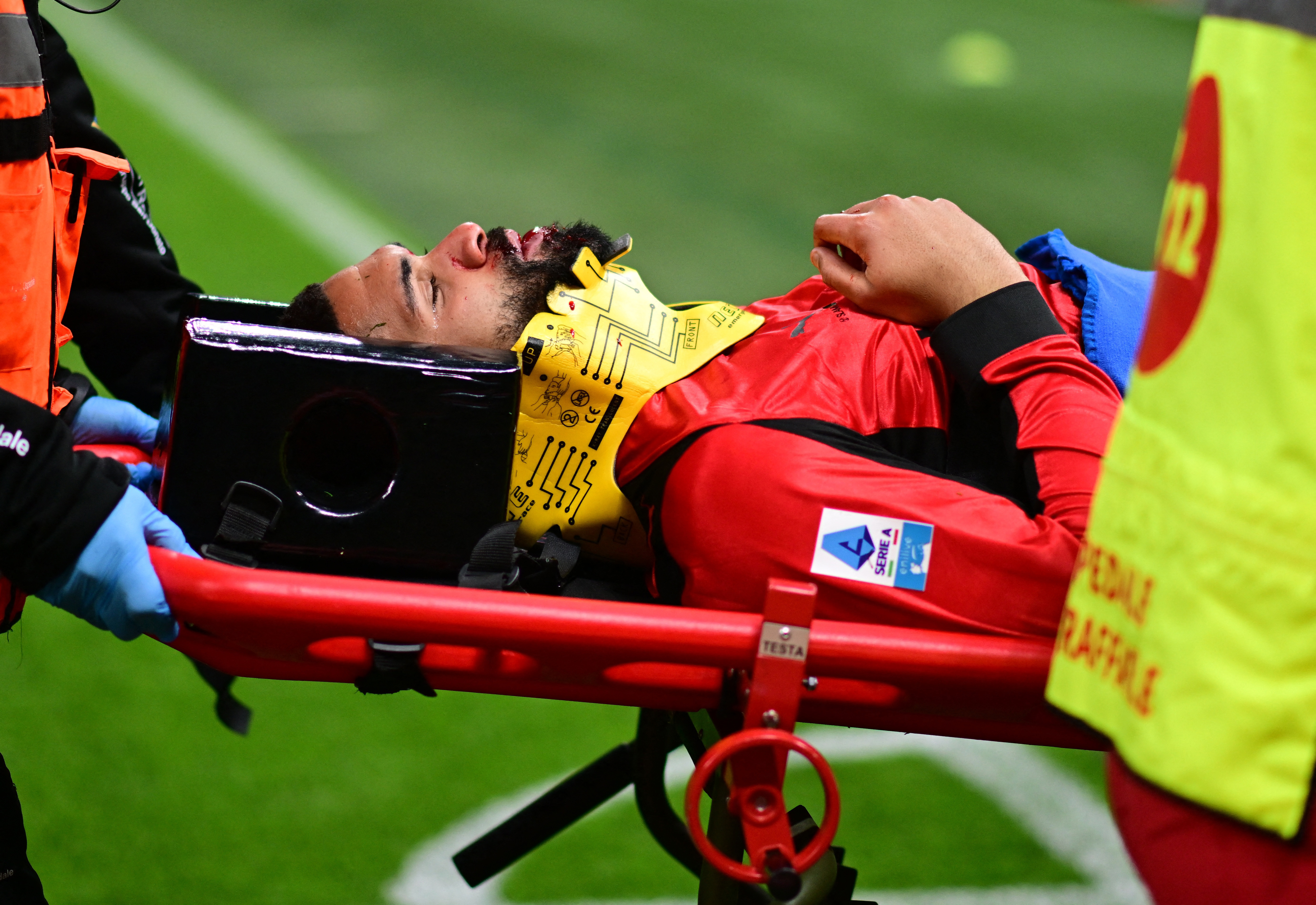 Soccer Football - Serie A - AC Milan v Parma - San Siro, Milan, Italy - February 22, 2026 AC Milan's Ruben Loftus-Cheek is carried off the pitch on a stretcher after sustaining an injury from a collision with Parma's Edoardo Corvi REUTERS/Daniele Mascolo
