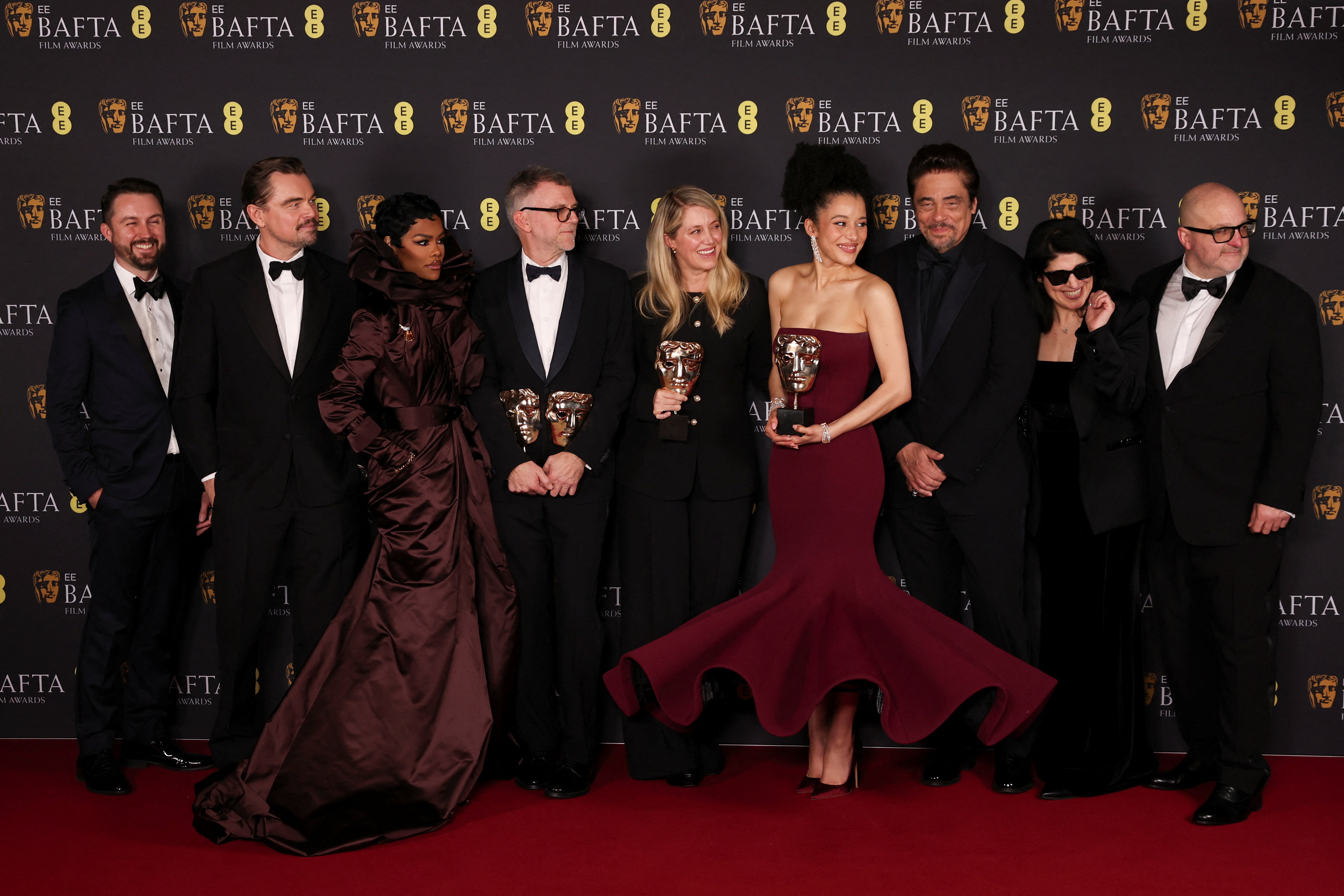 Director Paul Thomas Anderson, cast members Leonardo DiCaprio, Benicio Del Toro, Teyana Taylor, Chase Infiniti and crew pose with the awards for Best Film, Best Director and Best Adapted Screeplay for 'One Battle After Another'