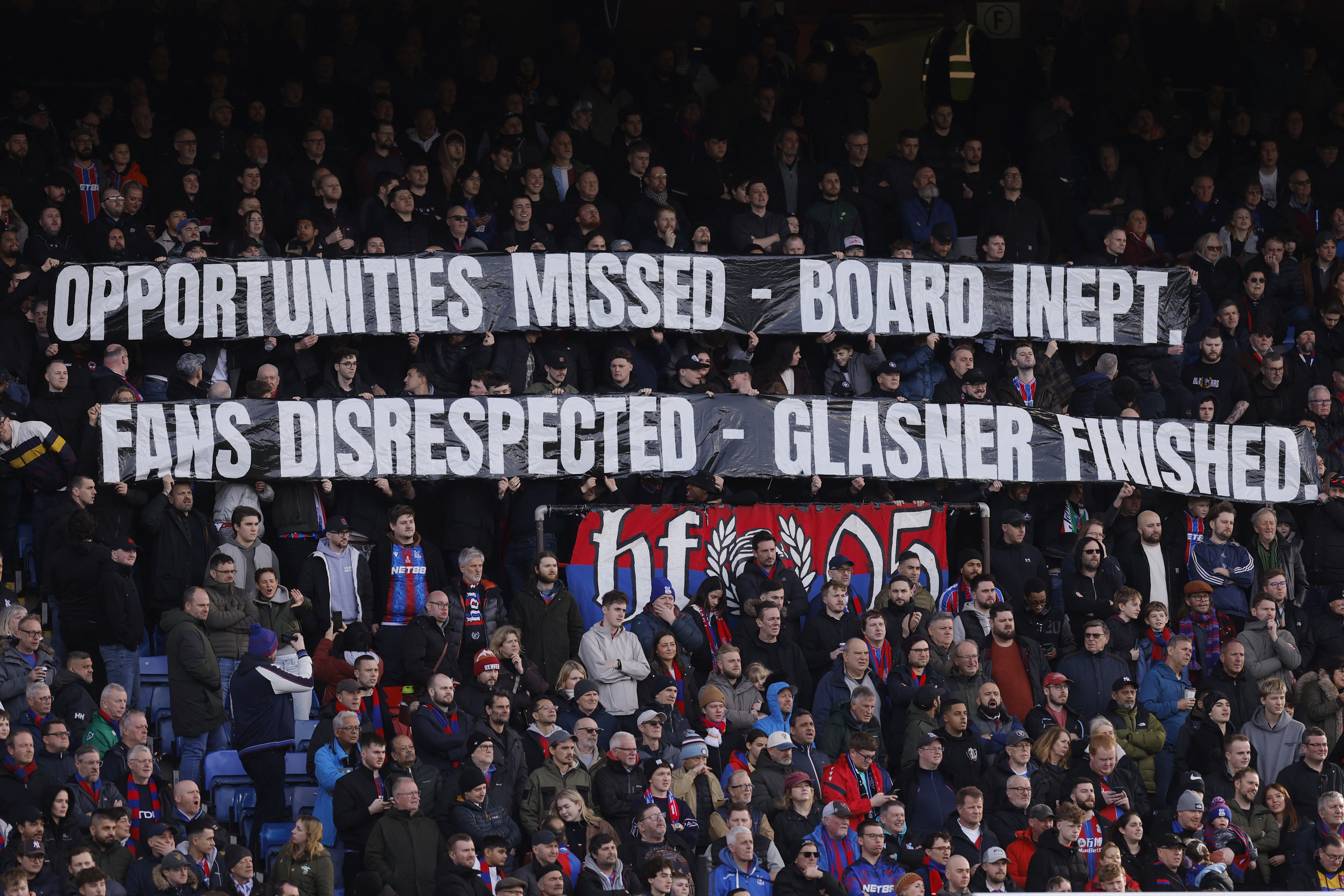 Soccer Football - Premier League - Crystal Palace v Wolverhampton Wanderers - Selhurst Park, London, Britain - February 22, 2026 Crystal Palace fans with a banner in protest to ownership and manager Oliver Glasner during the match Action Images via Reuter