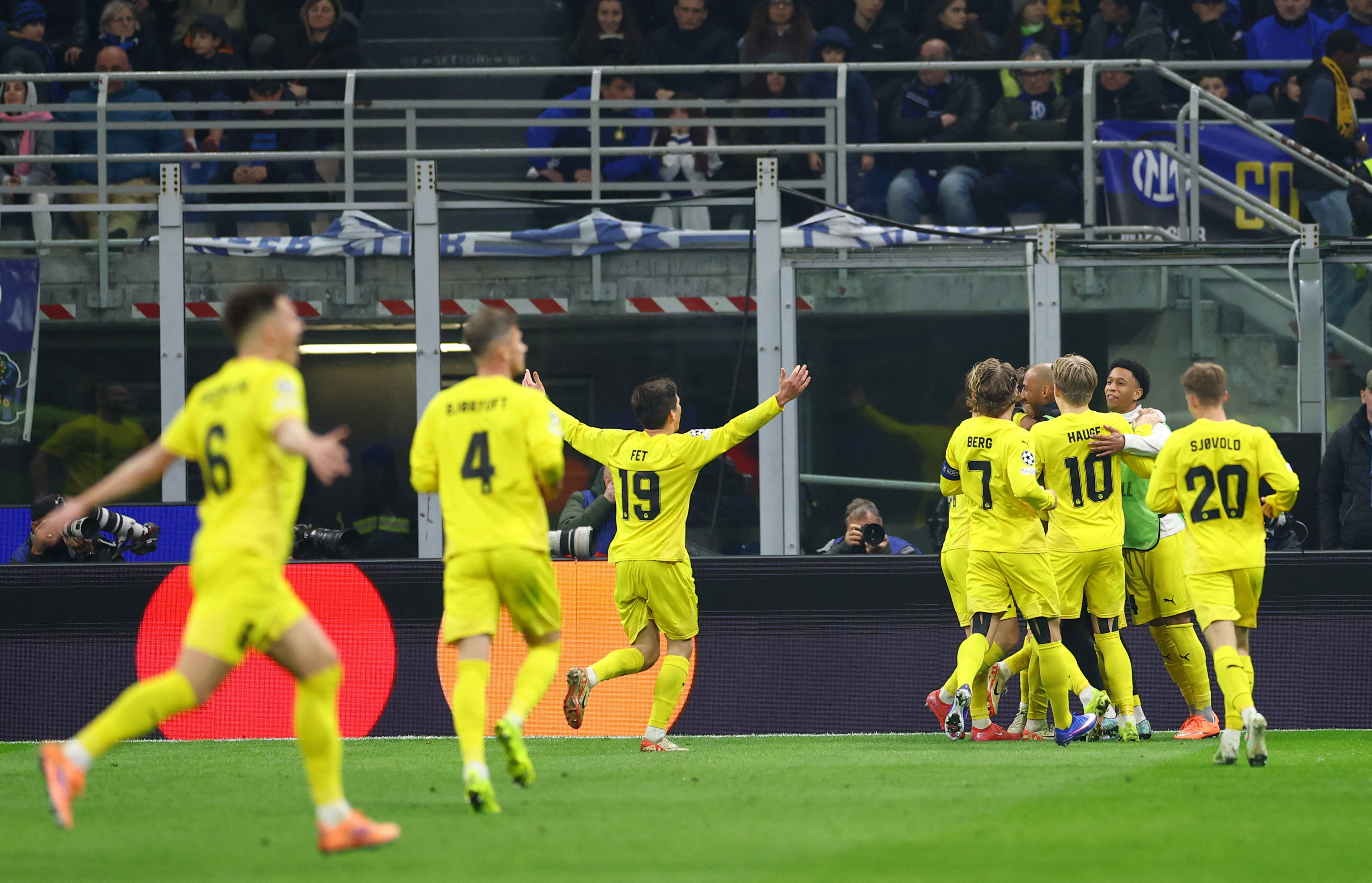 Soccer Football - UEFA Champions League - Play Off - Second Leg - Inter Milan v Bodo/Glimt - San Siro, Milan, Italy - February 24, 2026 Bodo/Glimt's Hakon Evjen celebrates scoring their second goal with teammates REUTERS/Claudia Greco