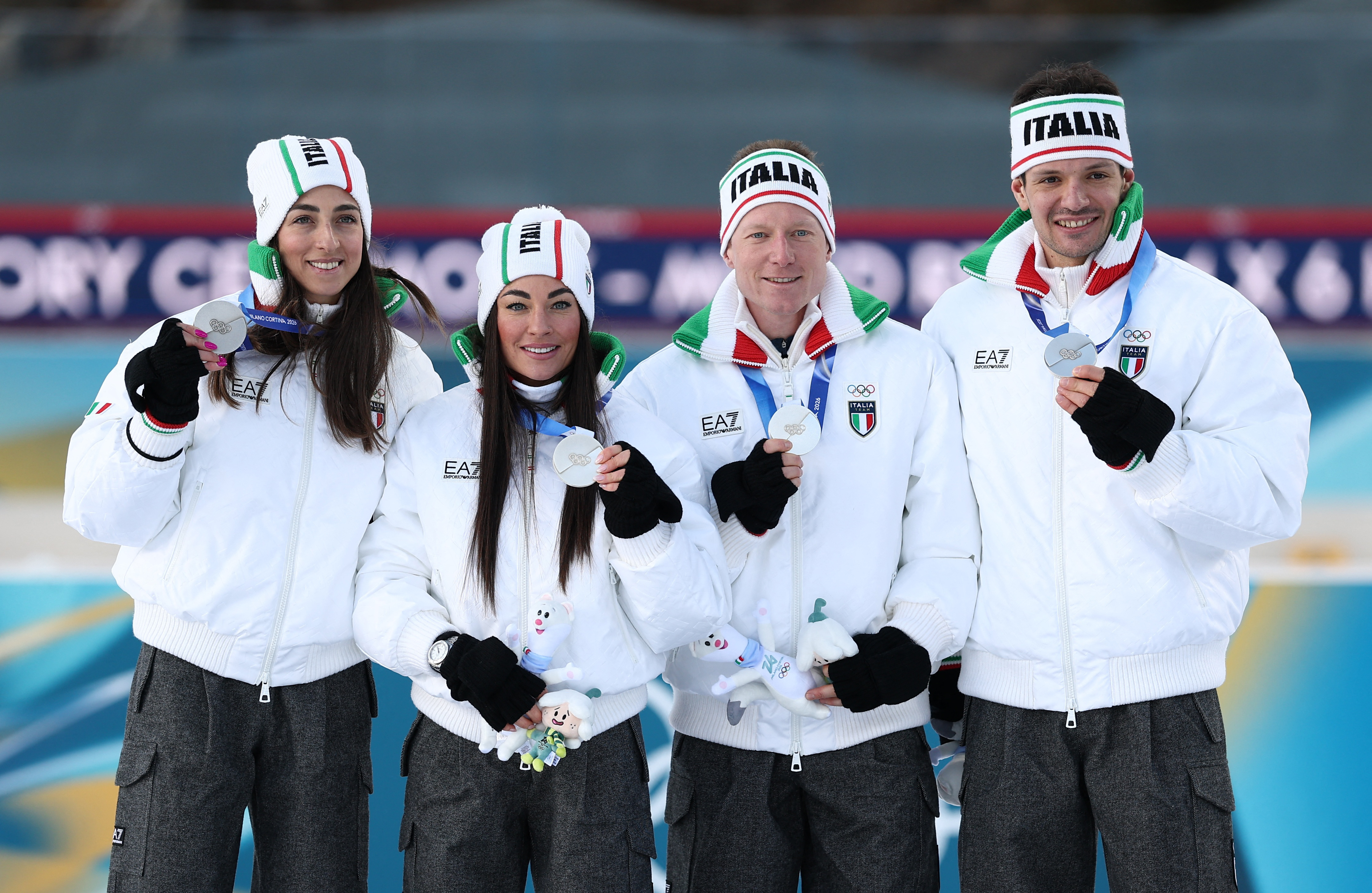 Milano Cortina 2026 Olympics - Biathlon - Mixed Relay Victory Ceremony - Anterselva Biathlon Arena, South Tyrol, Italy - February 08, 2026. Silver medallists Lisa Vittozzi, Dorothea Wierer, Lukas Hofer and Tommaso Giacomel of Italy celebrate on the podium