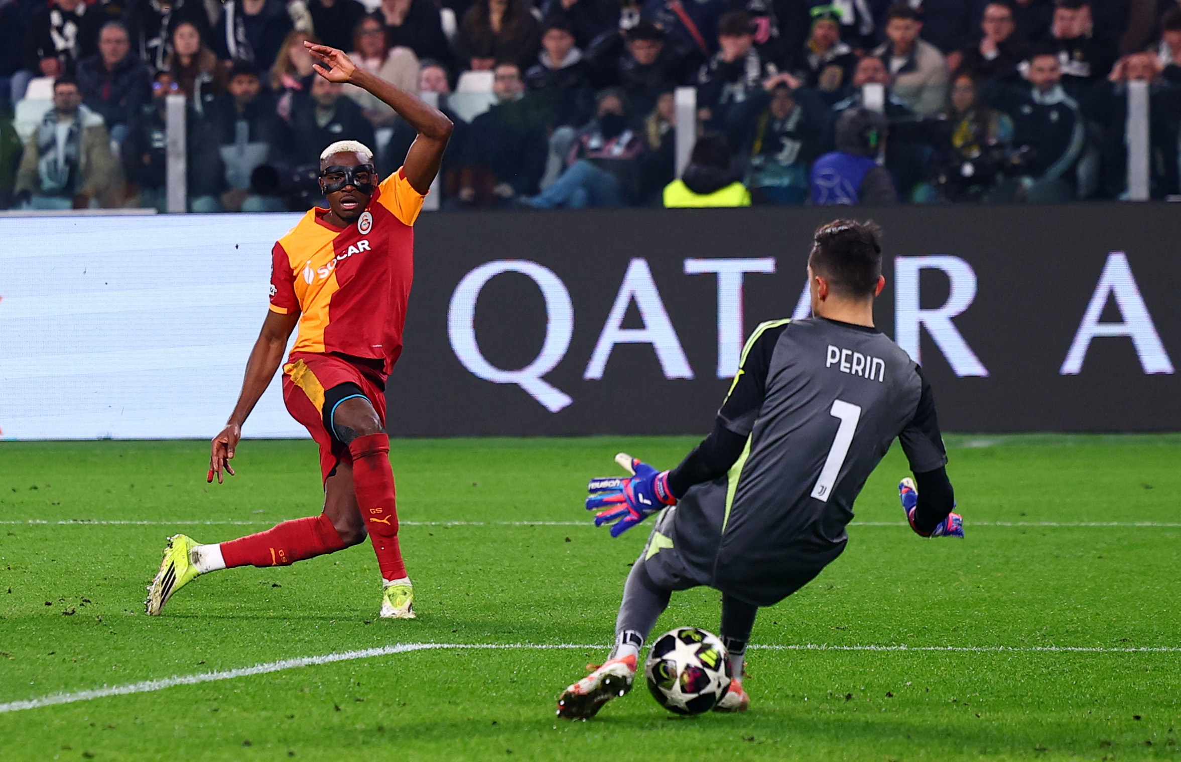 Soccer Football - UEFA Champions League - Play Off - Second Leg - Juventus v Galatasaray - Allianz Stadium, Turin, Italy - February 25, 2026 Galatasaray's Victor Osimhen scores their first goal past Juventus' Mattia Perin REUTERS/Guglielmo Mangiapane
