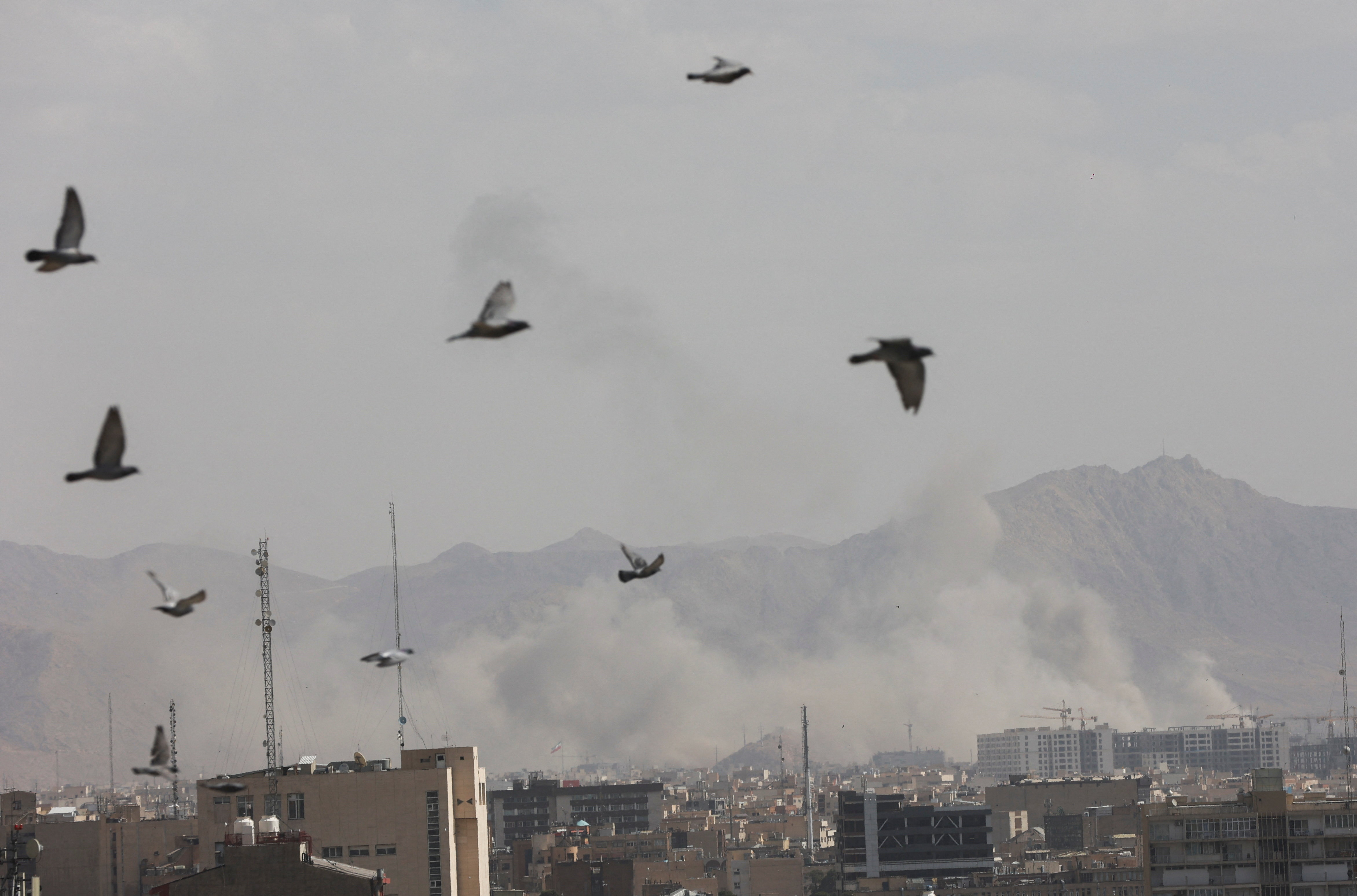 Smoke rises following an explosion, after Israel and the U.S. launched