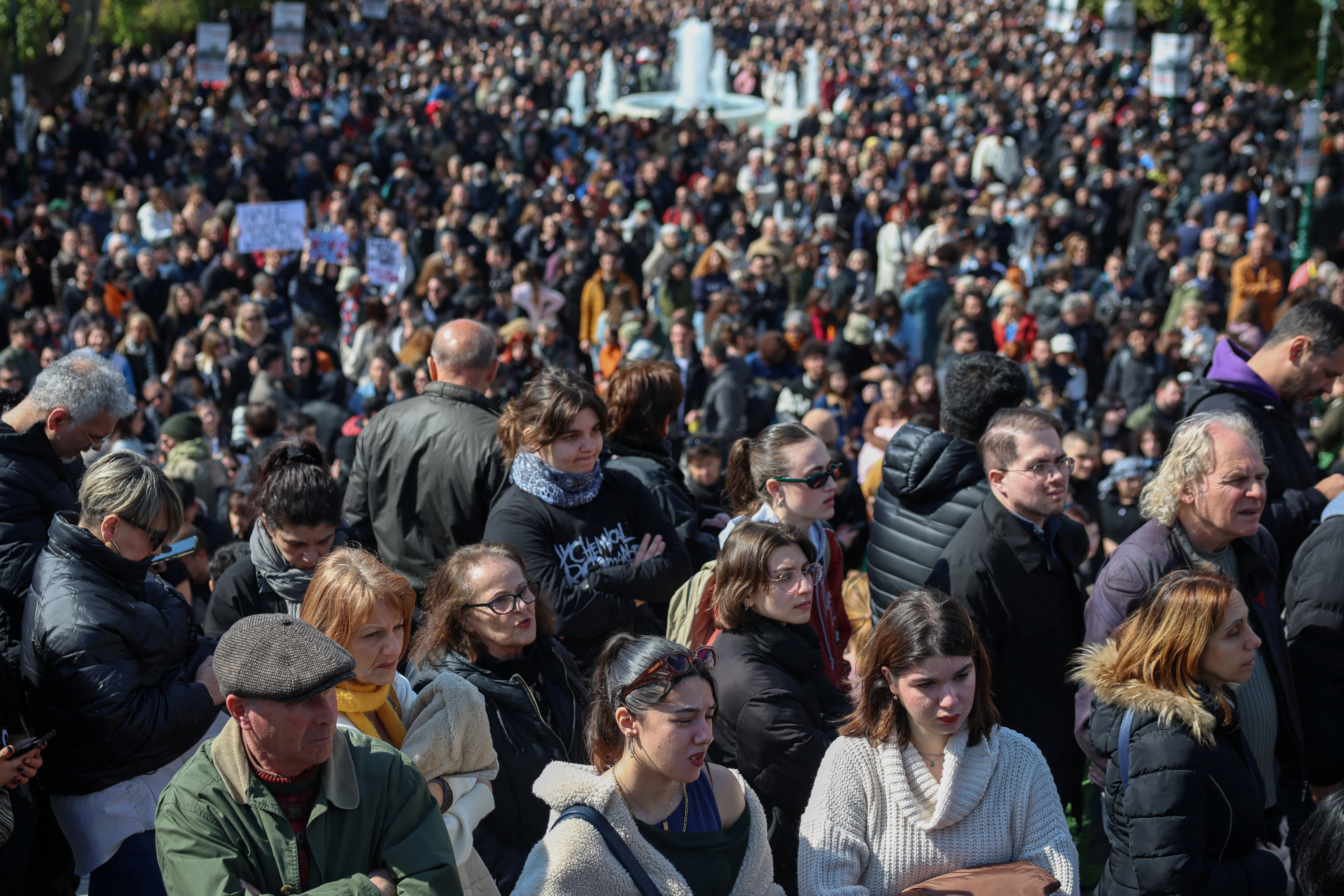 Protestors gather during a rally to mark the third anniversary of a deadly