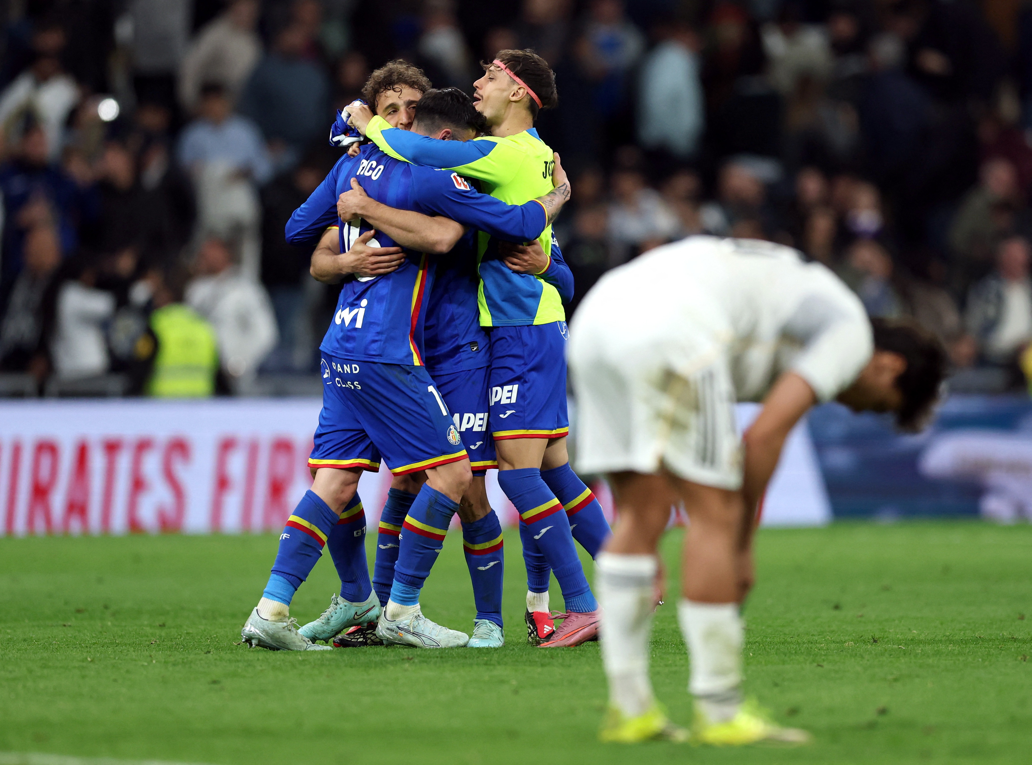 Soccer Football - LaLiga - Real Madrid v Getafe - Santiago Bernabeu, Madrid, Spain - March 2, 2026 Getafe's Diego Rico with teammates celebrate after the match REUTERS/Violeta Santos Moura