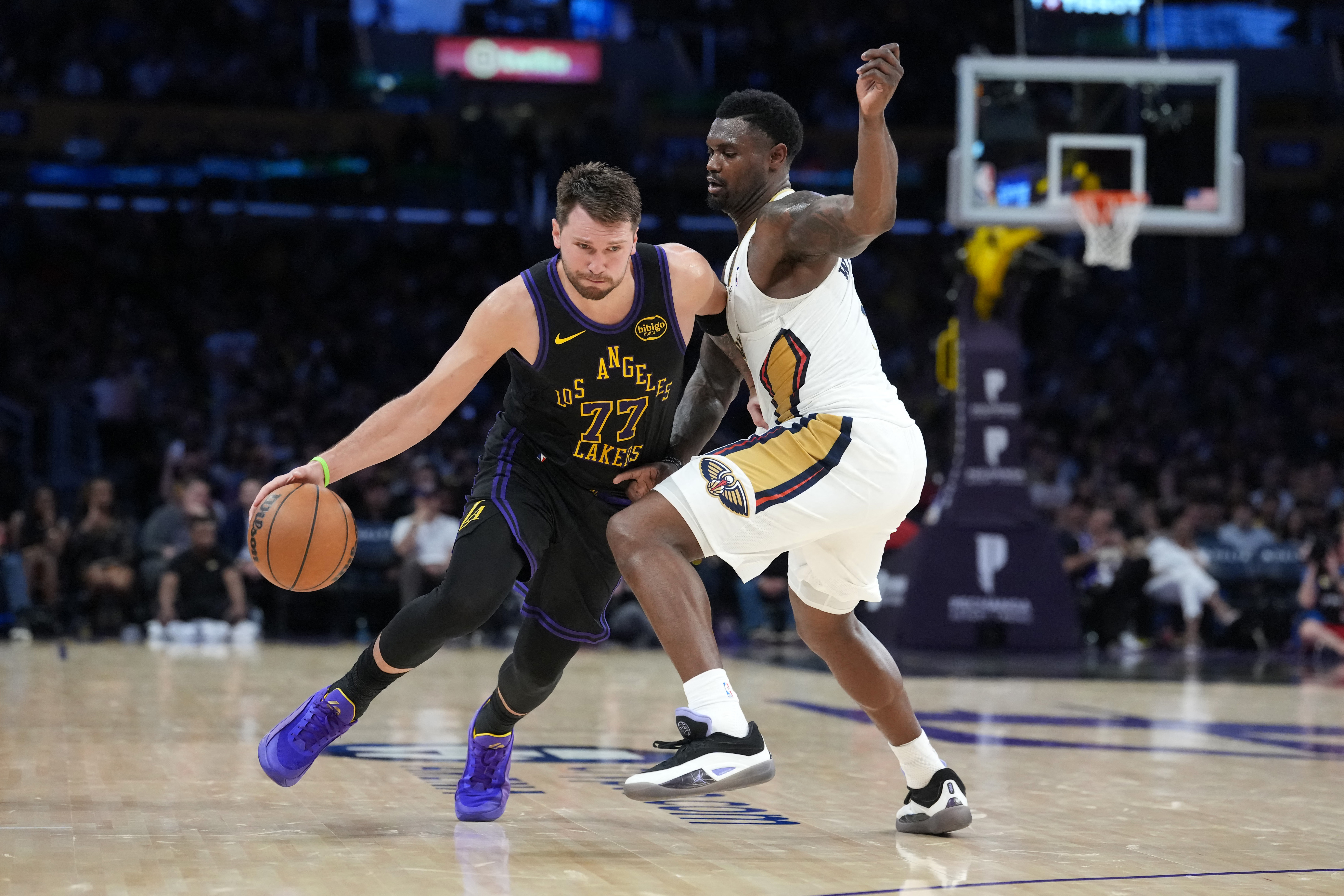 Mar 3, 2026; Los Angeles, California, USA; Los Angeles Lakers guard Luka Doncic (77) dribbles the ball against New Orleans Pelicans guard Saddiq Bey (41) in the second half at Crypto.com Arena. Mandatory Credit: Kirby Lee-Imagn Images