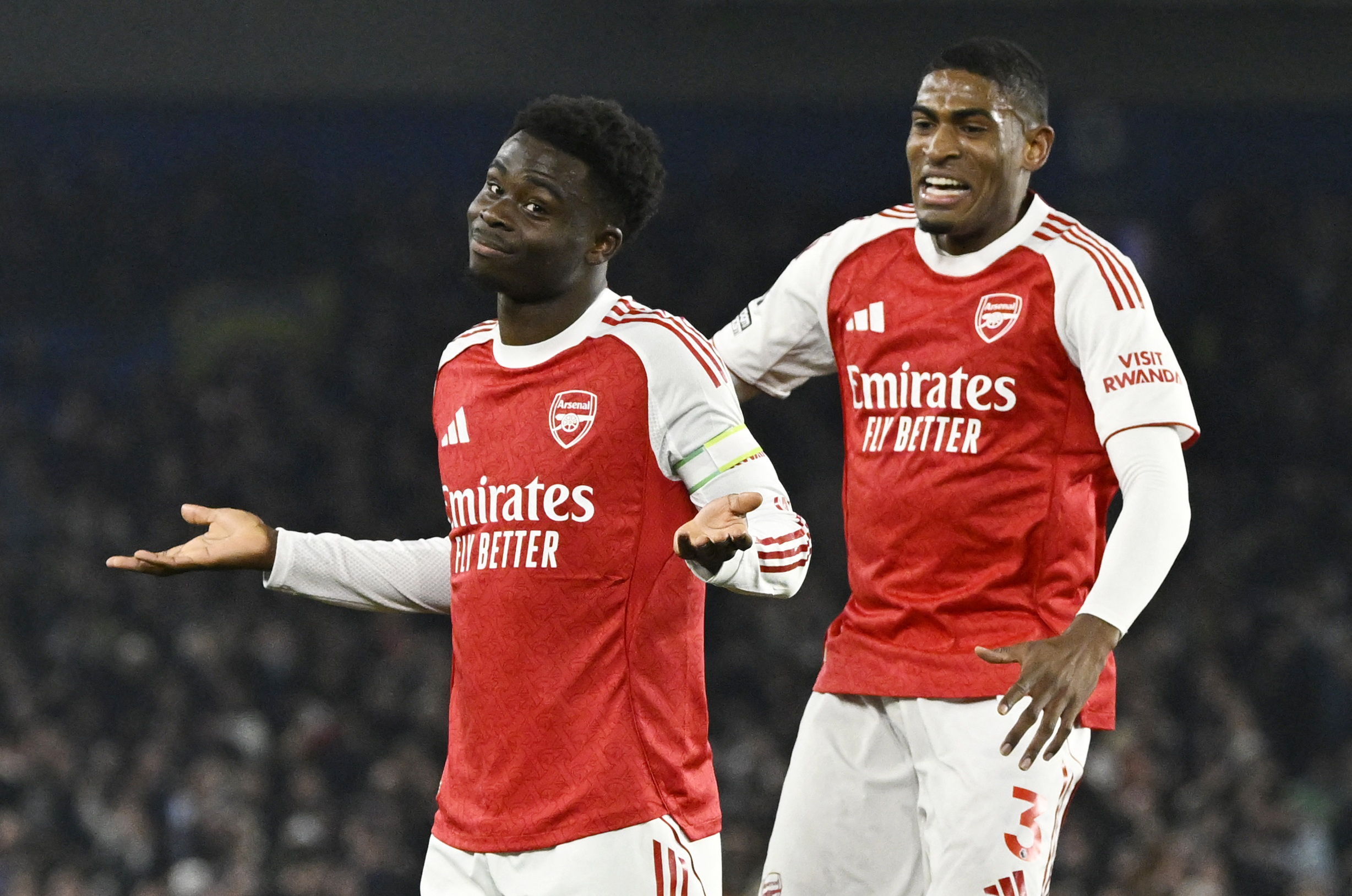 Soccer Football - Premier League - Brighton & Hove Albion v Arsenal - The American Express Community Stadium, Brighton, Britain - March 4, 2026 Arsenal's Bukayo Saka celebrates scoring their first goal with Cristhian Mosquera REUTERS/Tony O Brien EDITORIA