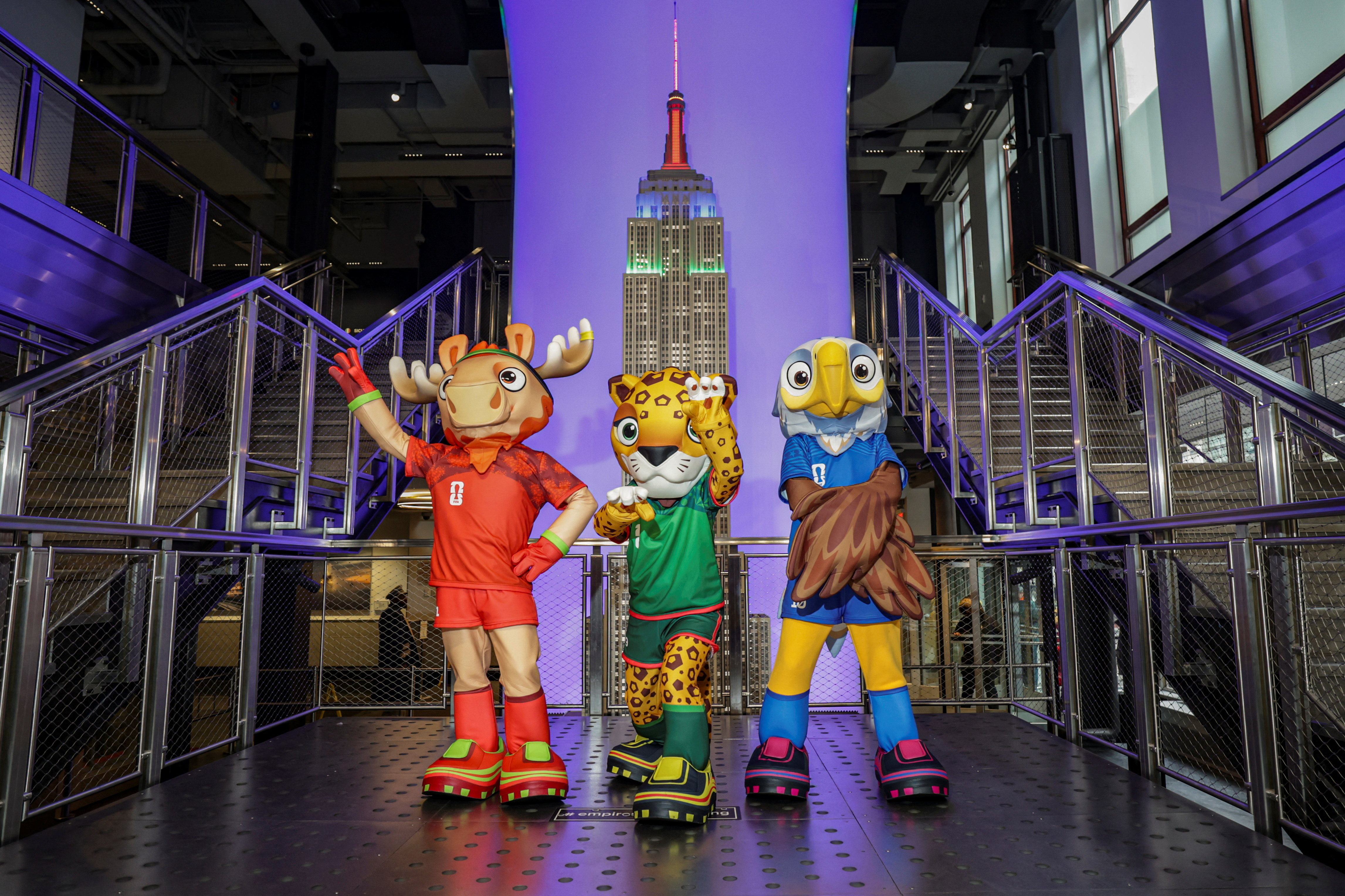 The FIFA World Cup 2026 mascots Maple, Zayu, and Clutch pose during a FIFA World Cup 2026 lighting ceremony marking 100 days until the tournament, at the Empire State Building, in New York City, U.S., March 3, 2026. REUTERS/Jeenah Moon