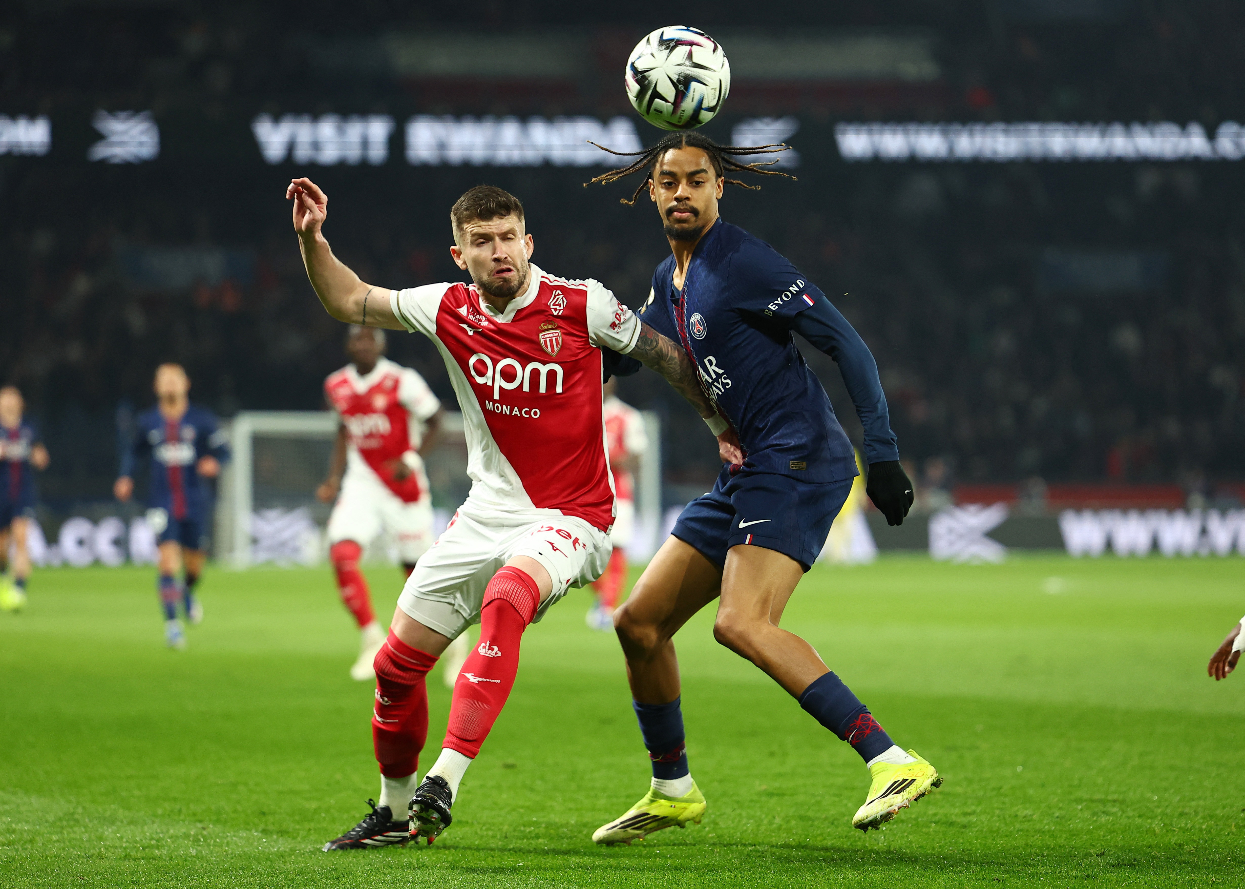 Soccer Football - Ligue 1 - Paris St Germain v AS Monaco - Parc des Princes, Paris, France - March 6, 2026 Paris St Germain's Bradley Barcola in action with AS Monaco's Caio Henrique REUTERS/Abdul Saboor