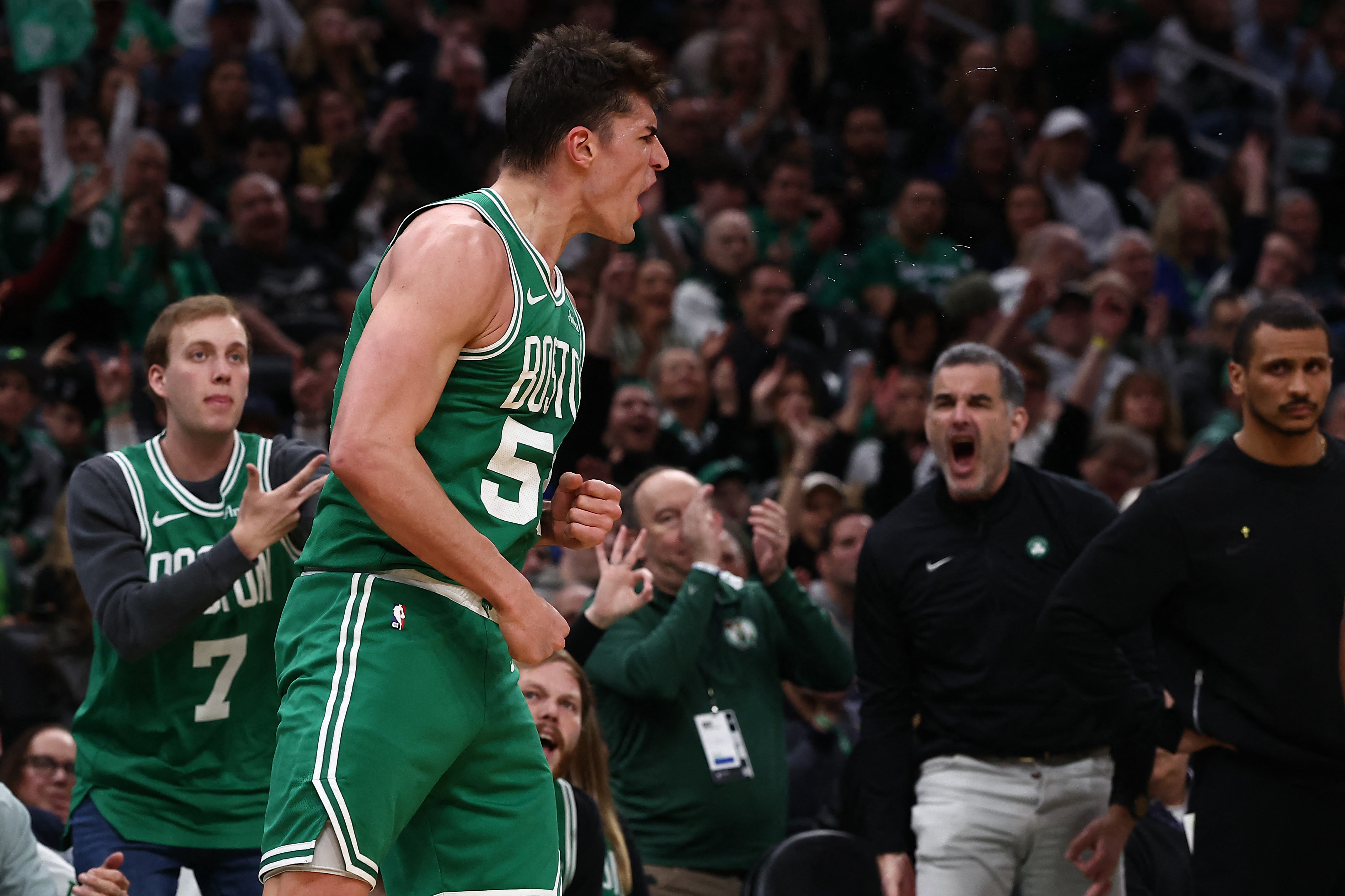 Mar 6, 2026; Boston, Massachusetts, USA; Boston Celtics center Luka Garza (52) celebrates after making a three point basket against the Dallas Mavericks during the second quarter at TD Garden. Mandatory Credit: Winslow Townson-Imagn Images