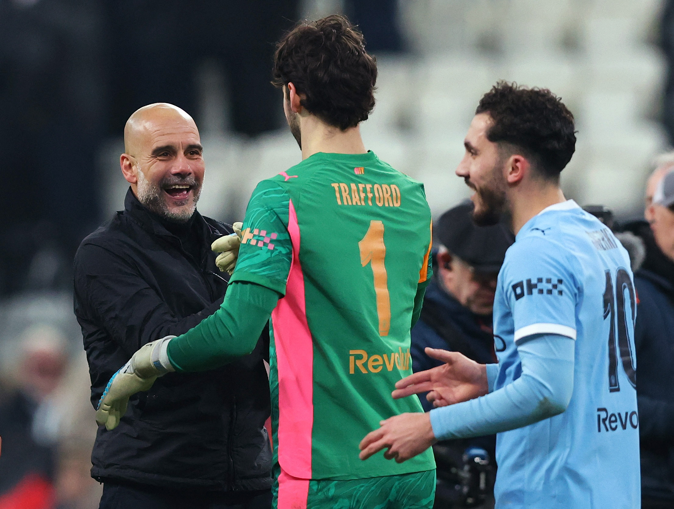 Soccer Football - FA Cup - Fifth Round - Newcastle United v Manchester City - St James' Park, Newcastle, Britain - March 7, 2026  Manchester City manager Pep Guardiola, James Trafford and Rayan Cherki celebrate after the match Action Images via Reuters/Cr